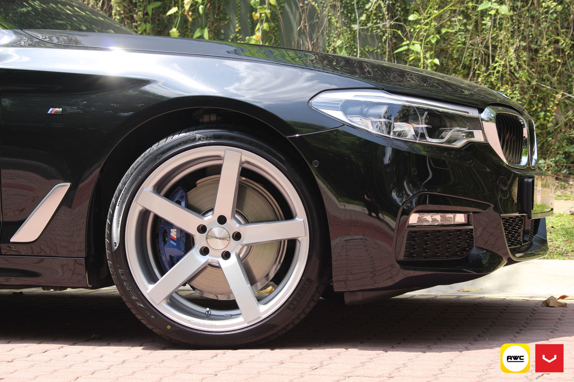 Black BMW 5-Series with Chrome Vossen Wheels - Photo by Vossen