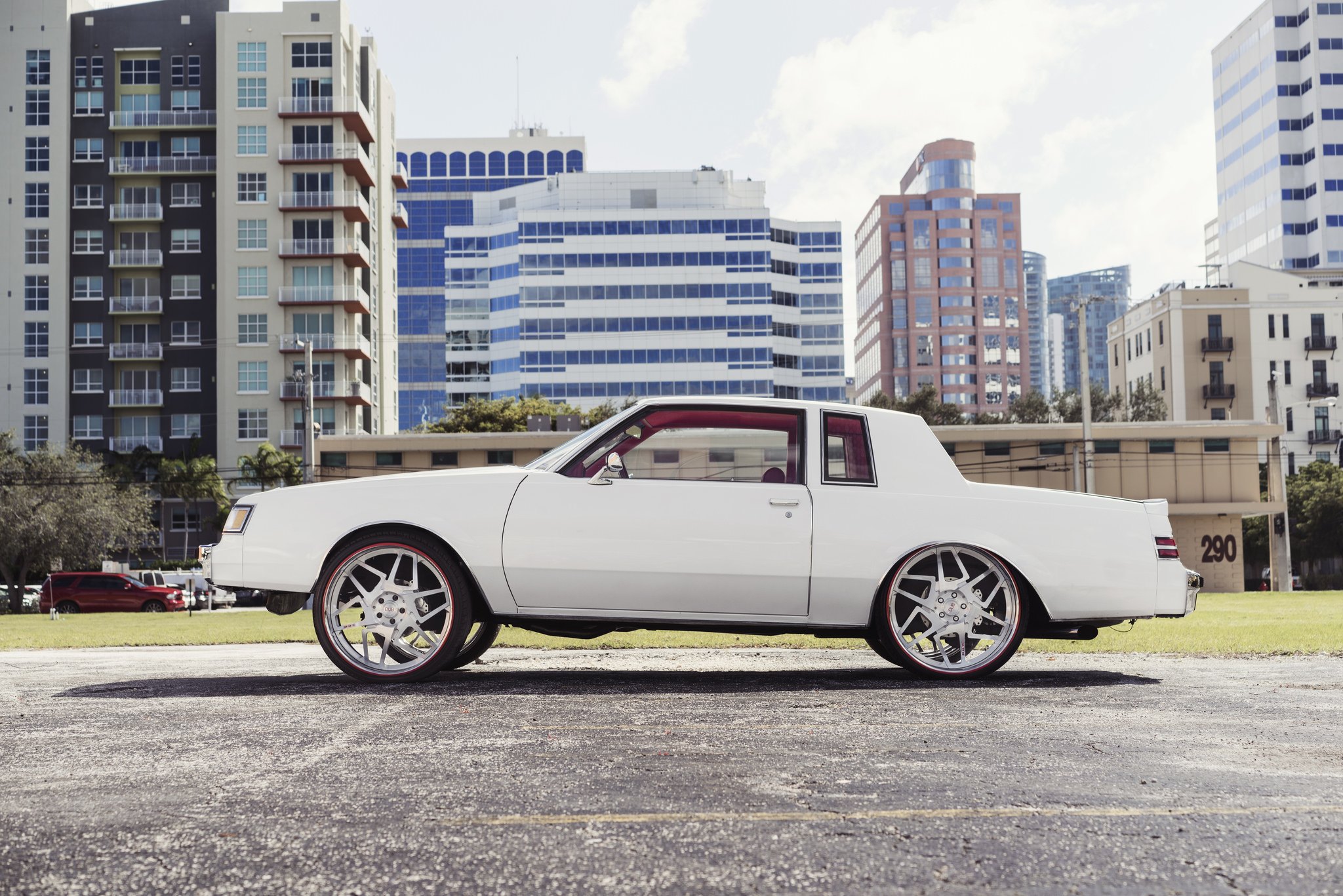 Whiite Lifted Buick Regal on 24 Inch DUB Wheels - Photo by DUB