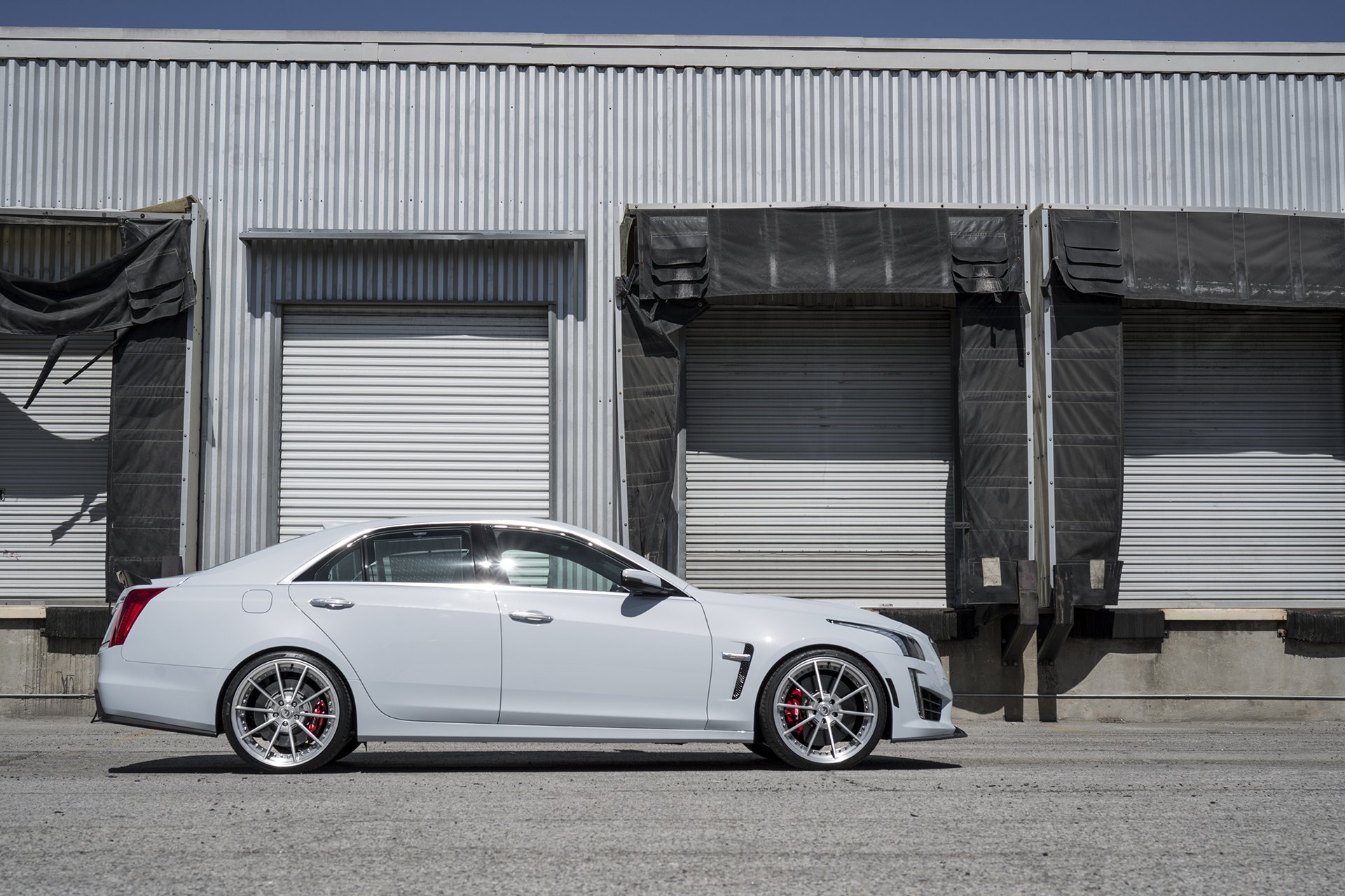 Aftermarket Side Skirts on Gray Cadillac CTS - Photo by Forgiato