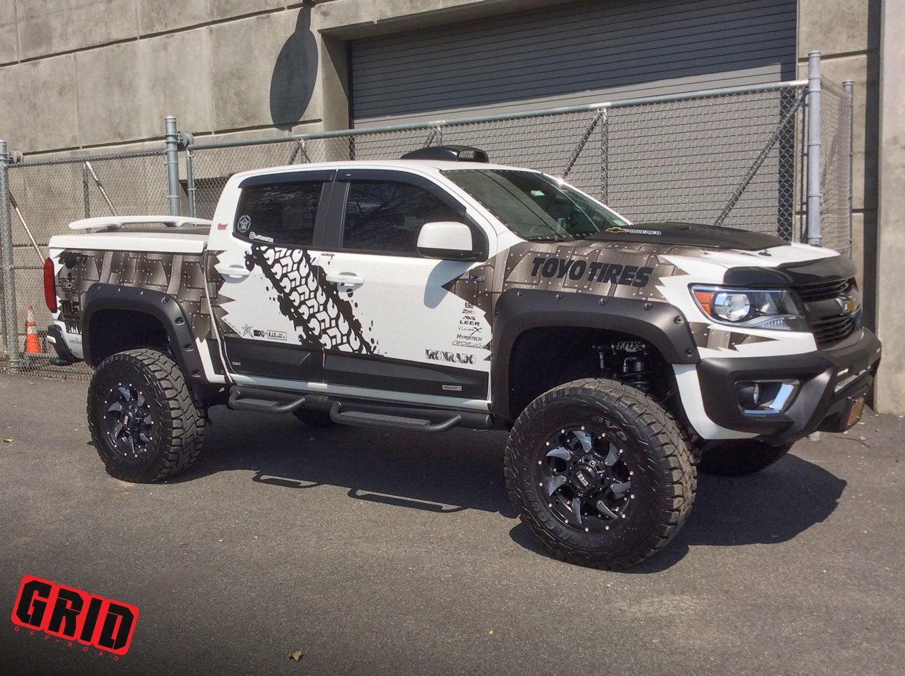 Custom Painted Chevy Colorado with Grid Off-Road Wheels - Photo by Grid Off-Road