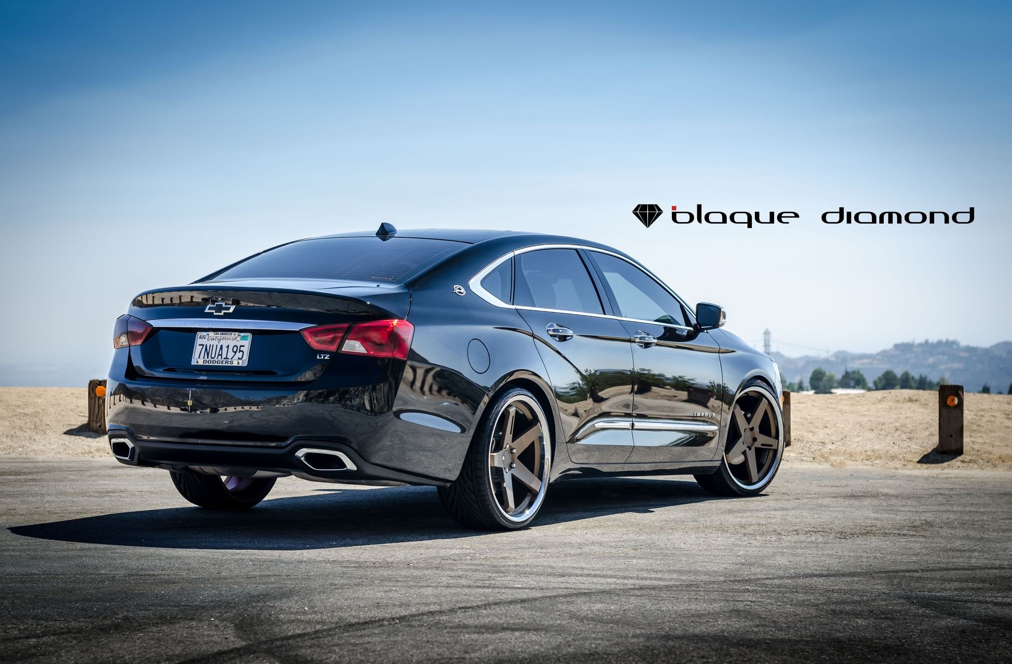 Aftermarket Rear Diffuser on Black Chevy Impala - Photo by Blaque Diamond