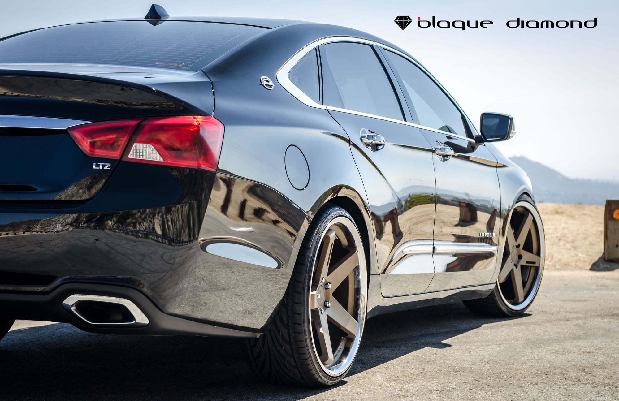 Black Chevy Impala with Bronze Blaque Diamond Wheels - Photo by Blaque Diamond