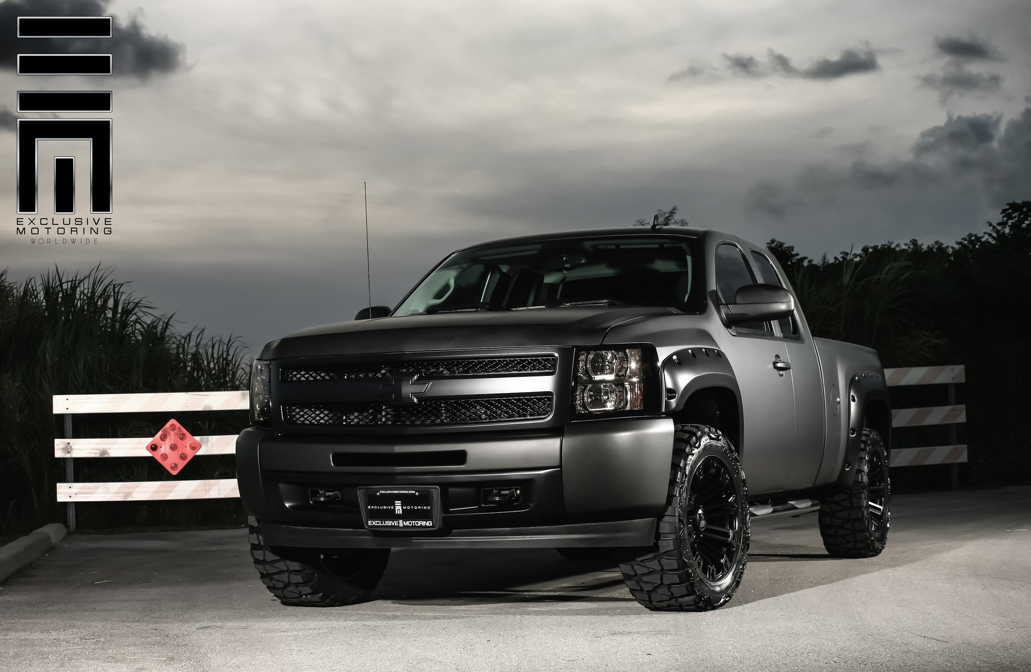 Matte-black Lifted Chevy Silverado With Bushwacker Fender Flares - Photo by Exclusive Motoring