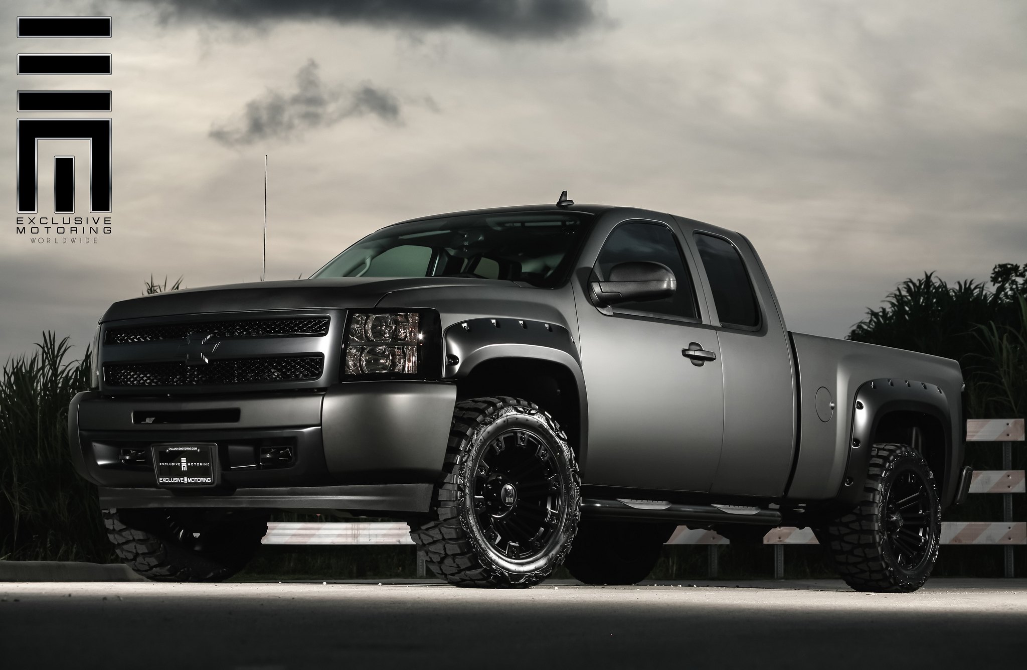 Lifted customized Chevy Silverado with tinted window - Photo by Exclusive Motoring