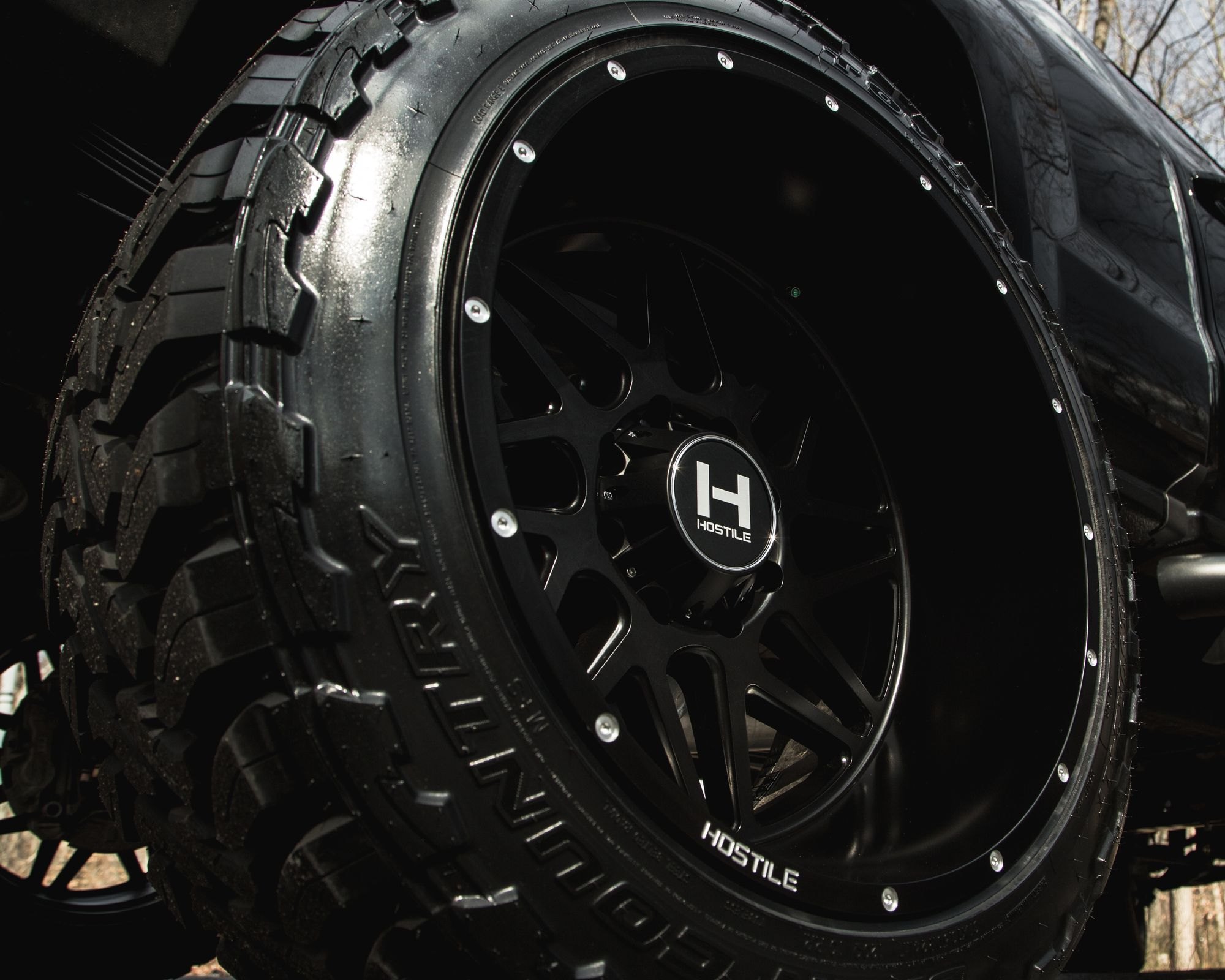Black Lifted Chevy Silverado with Custom Hostile Wheels - Photo by CARiD