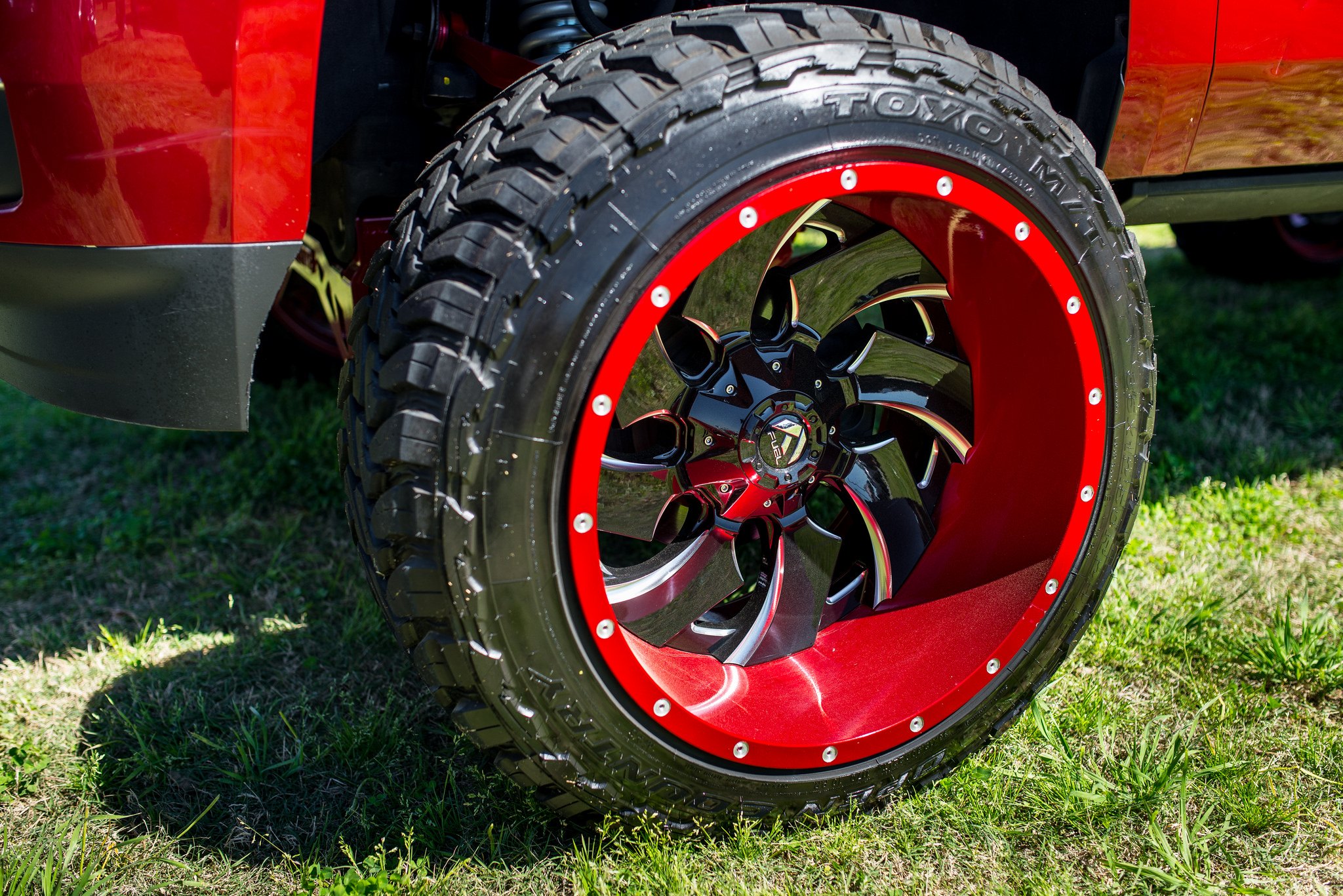Custom Fuel Offroad Wheels on Red Lifted Chevy Tahoe - Photo by Fuel Offroad