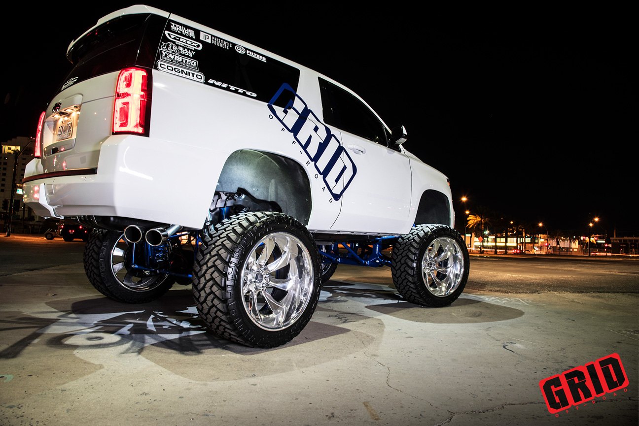 Chrome Grid Off-Road Rims on White Lifted Chevy Tahoe - Photo by Grid Off-Road