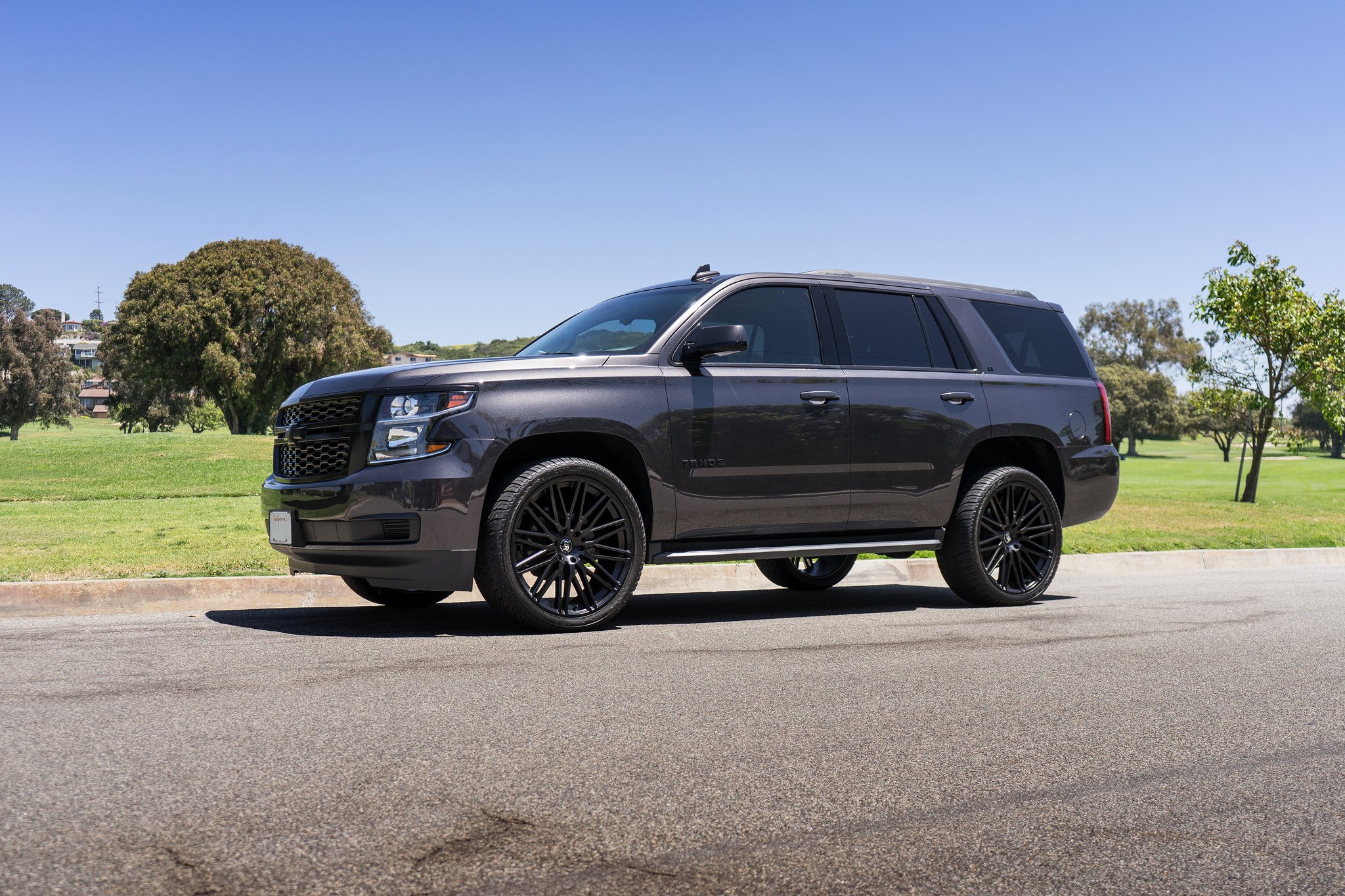 Aftermarket Running Boards on Black Chevy Tahoe - Photo by Black Rhino