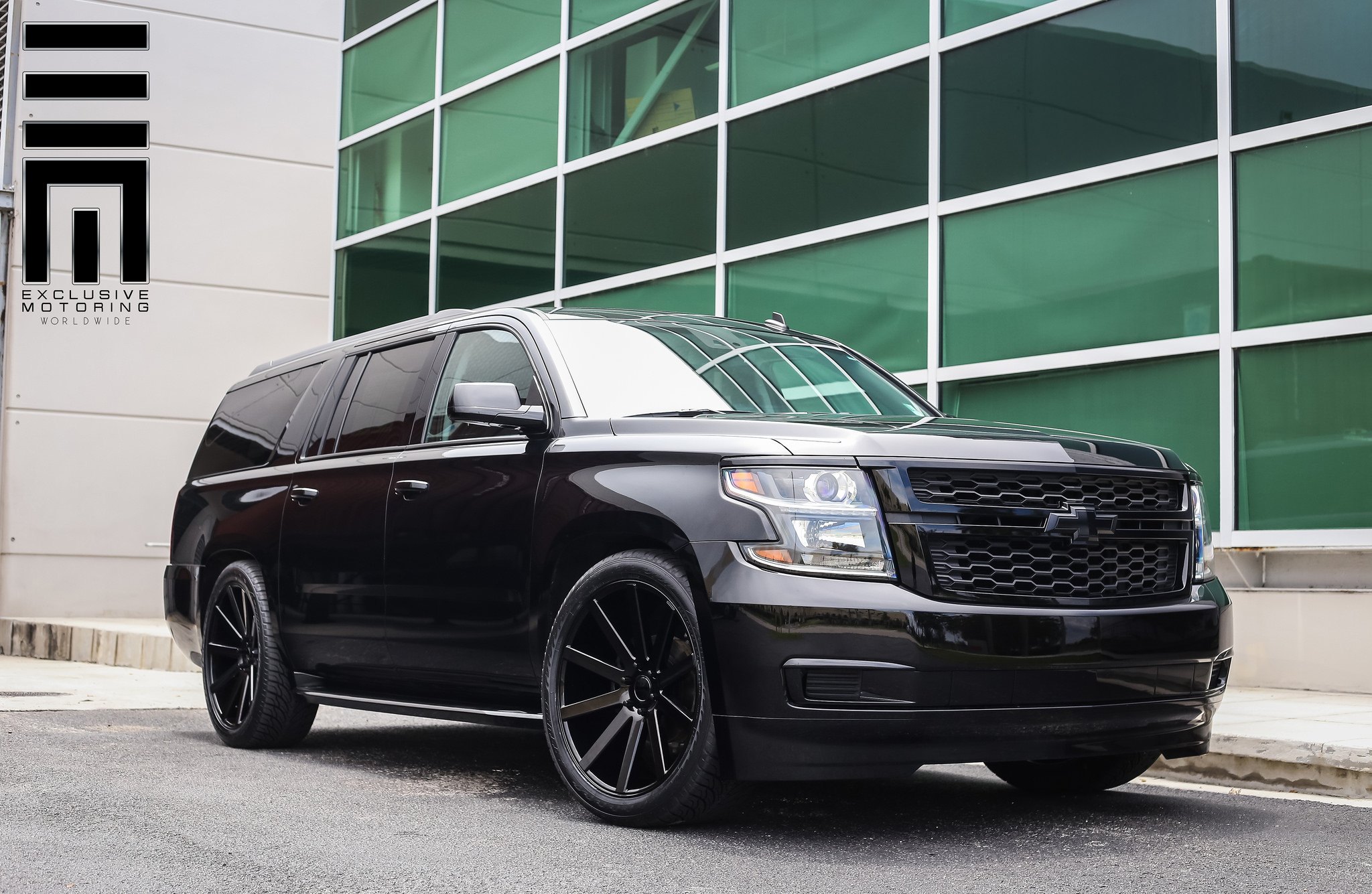 All Black Chevy Suburban on Custom Wheels - Photo by Exclusive Motoring