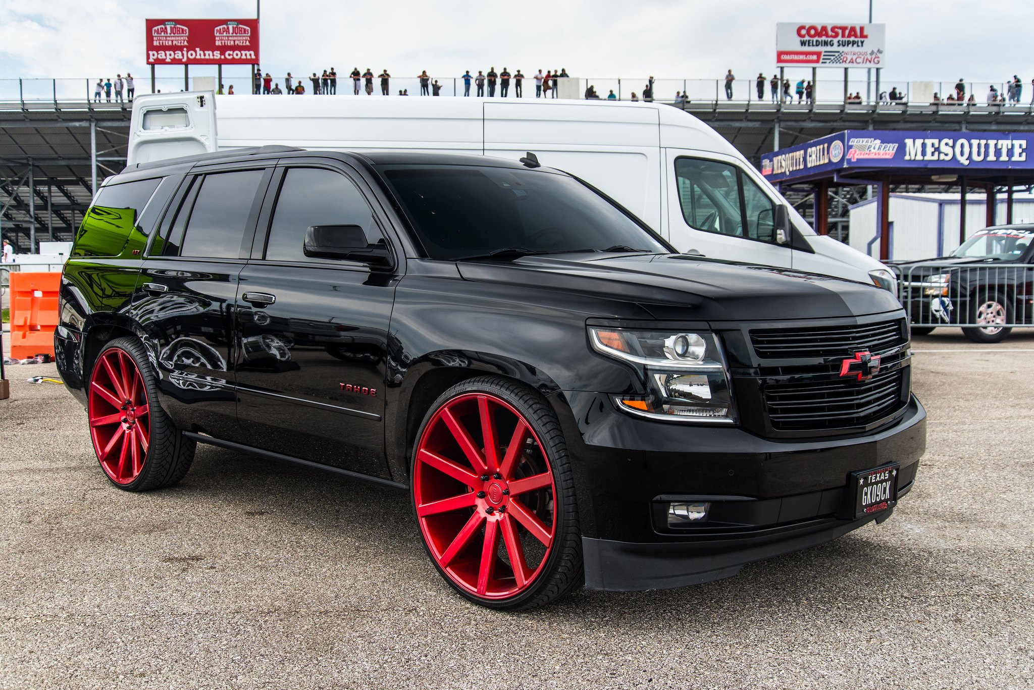 Red Color Matched DUB Wheels on Black Chevy Tahoe - Photo by DUB