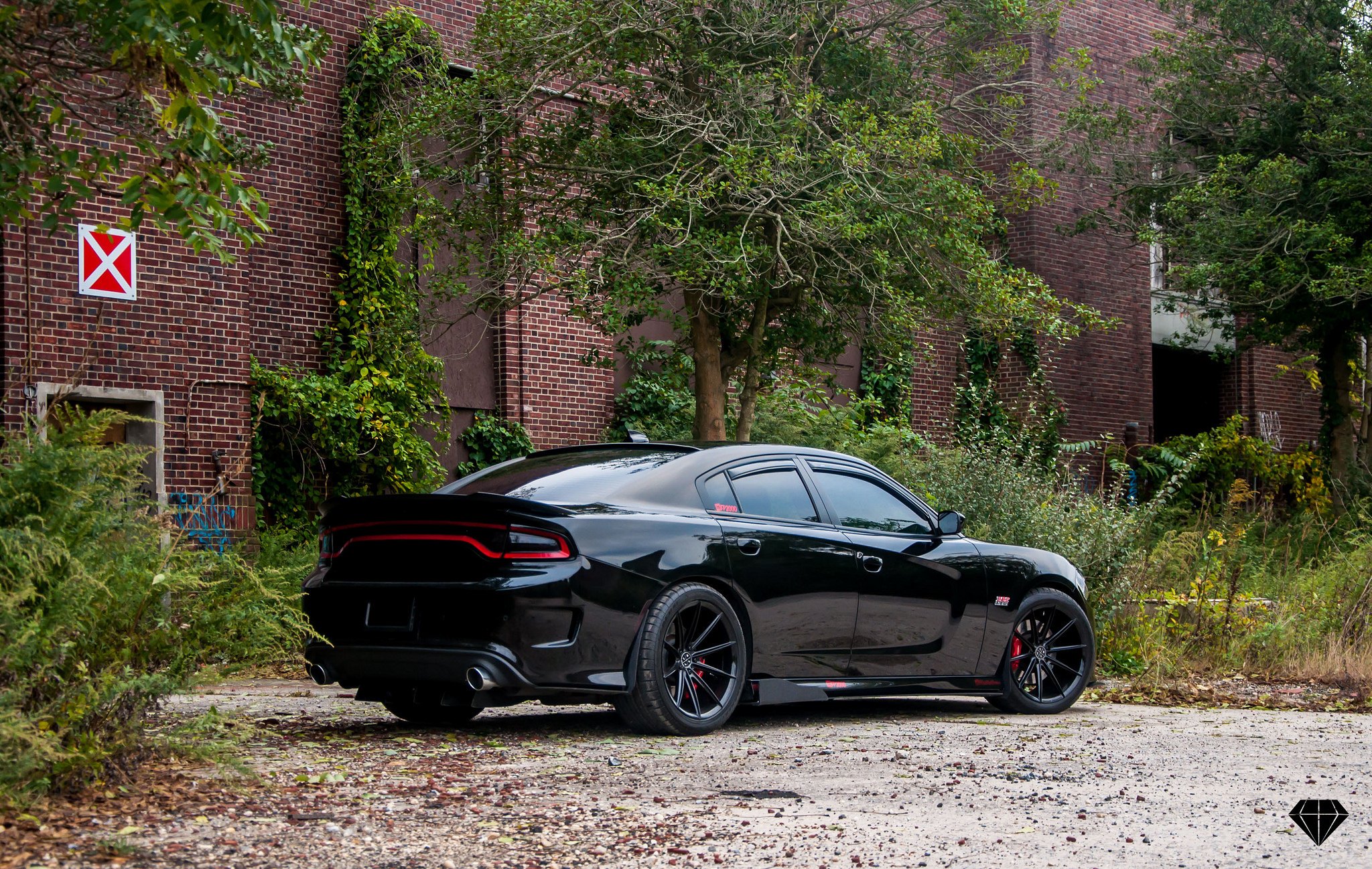 Black Dodge Charger Scat Pack with Aftermarket Rear Spoiler - Photo by Blaque Diamond Wheels