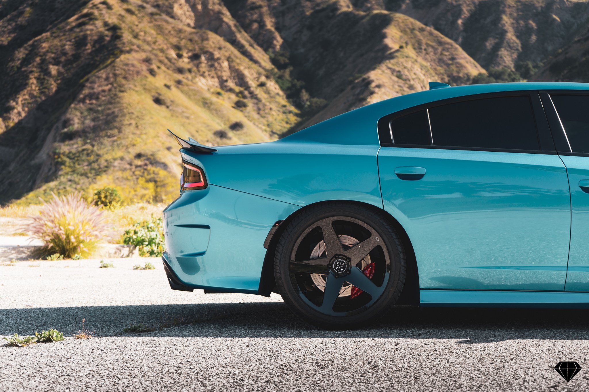 Blaque Diamond Rims with Red Brakes on Turquoise Dodge Charger - Photo by Blaque Diamond Wheels