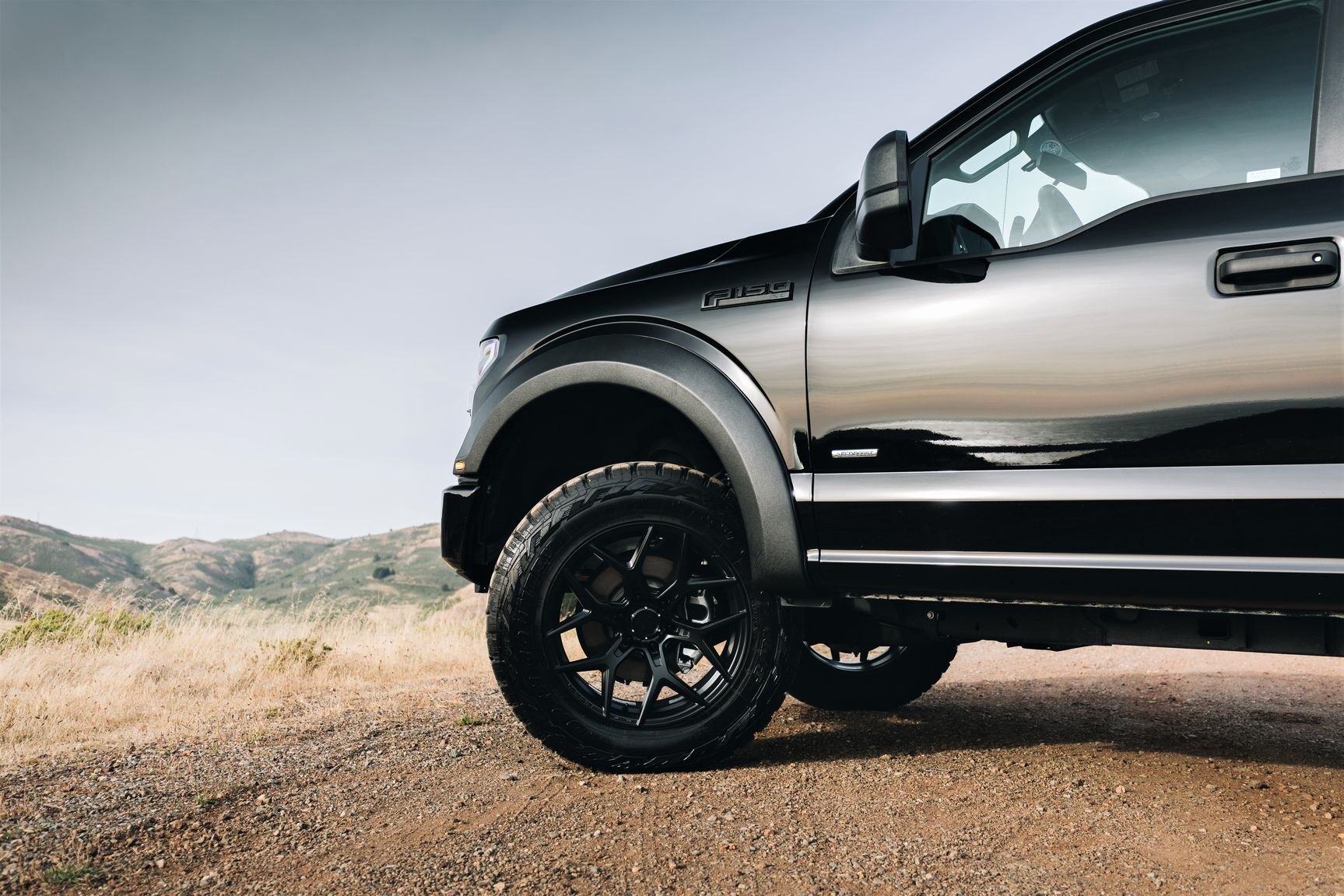 Black Lifted Ford F-150 with Retractable Running Boards - Photo by Venom Rex