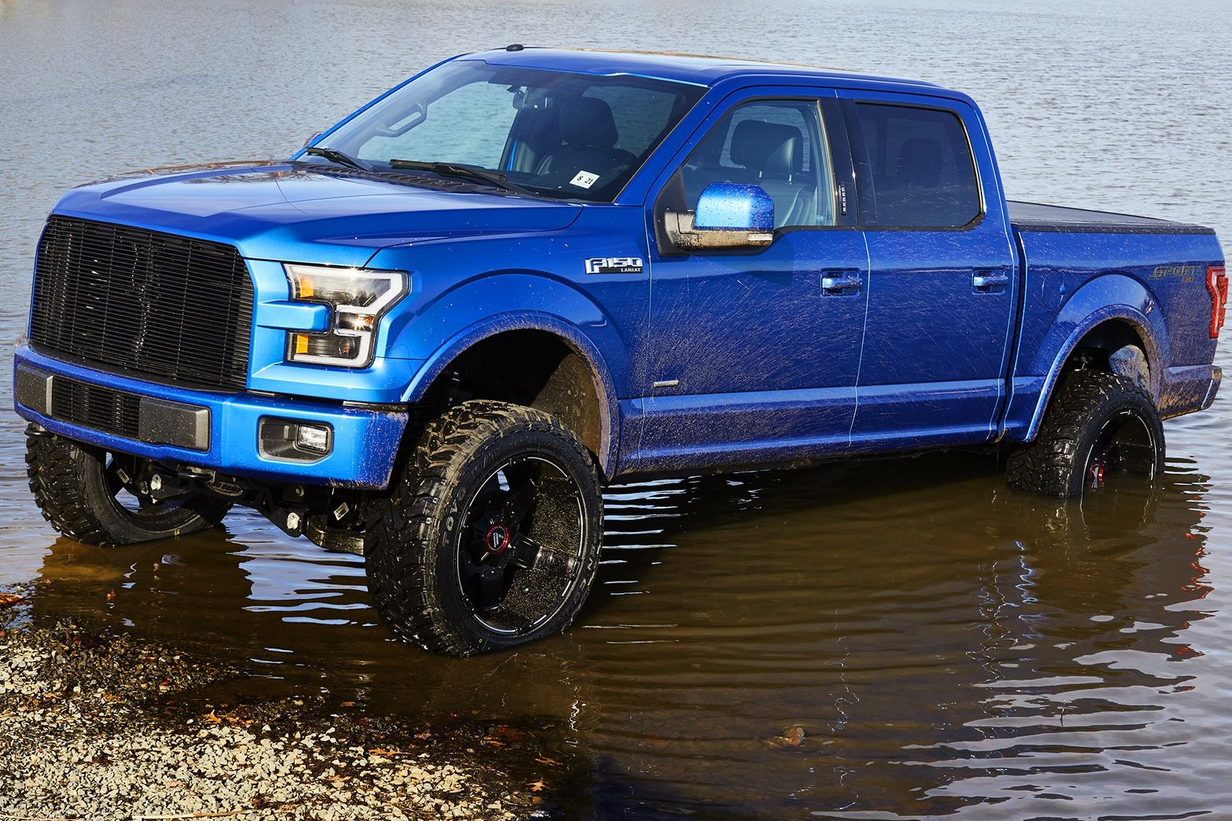 Blue Lifted Ford F-150 with Aftermarket Front Bumper - Photo by CARiD