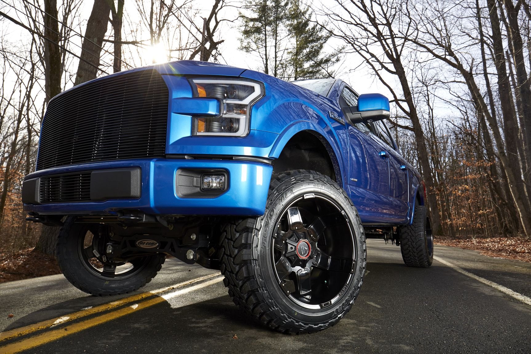 Toyo Open Country Tires on Blue Lifted Ford F-150 - Photo by CARiD