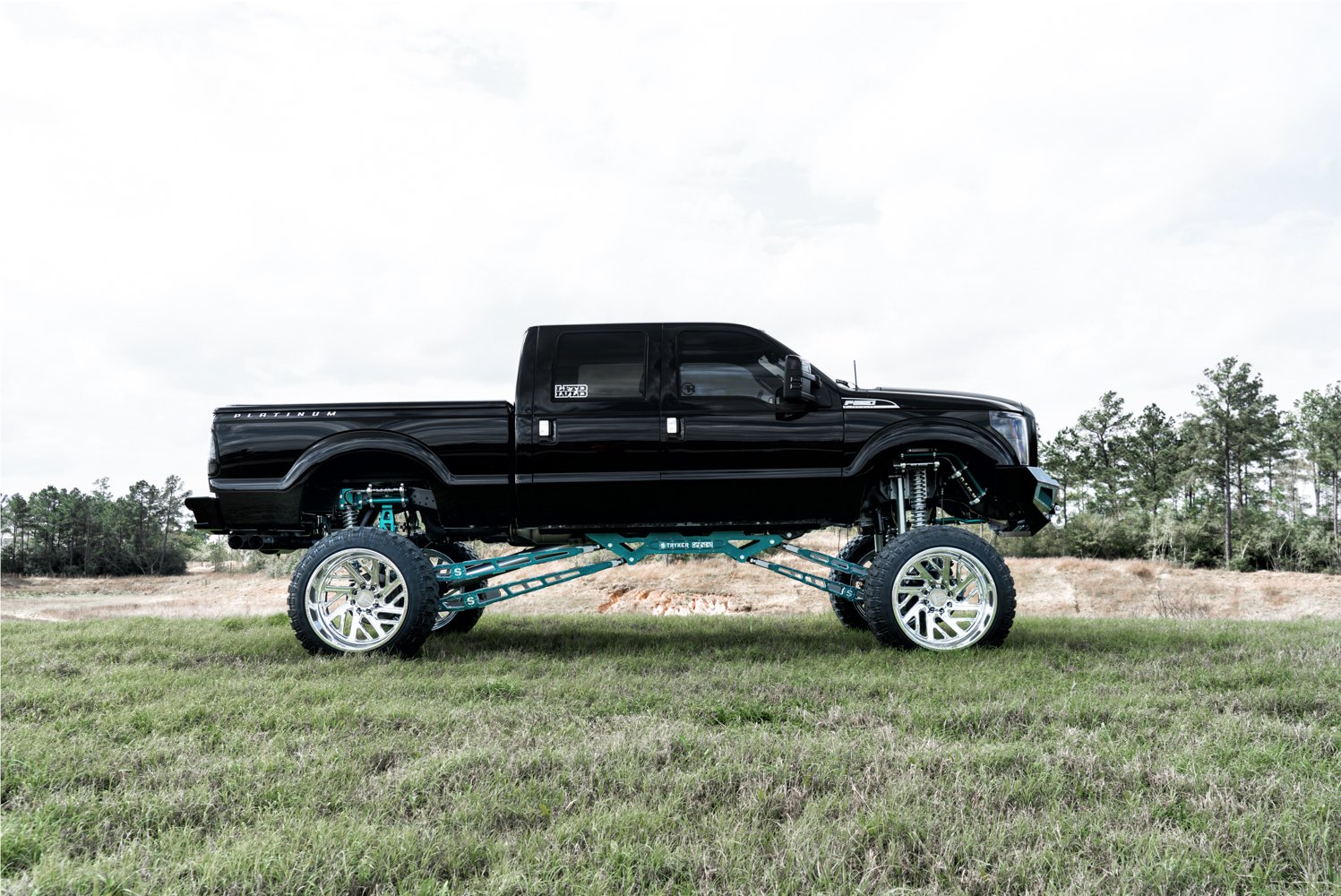 Fully Custom Black F250 With a Massive Lift and 40" Wheels - Photo by Dale Martin