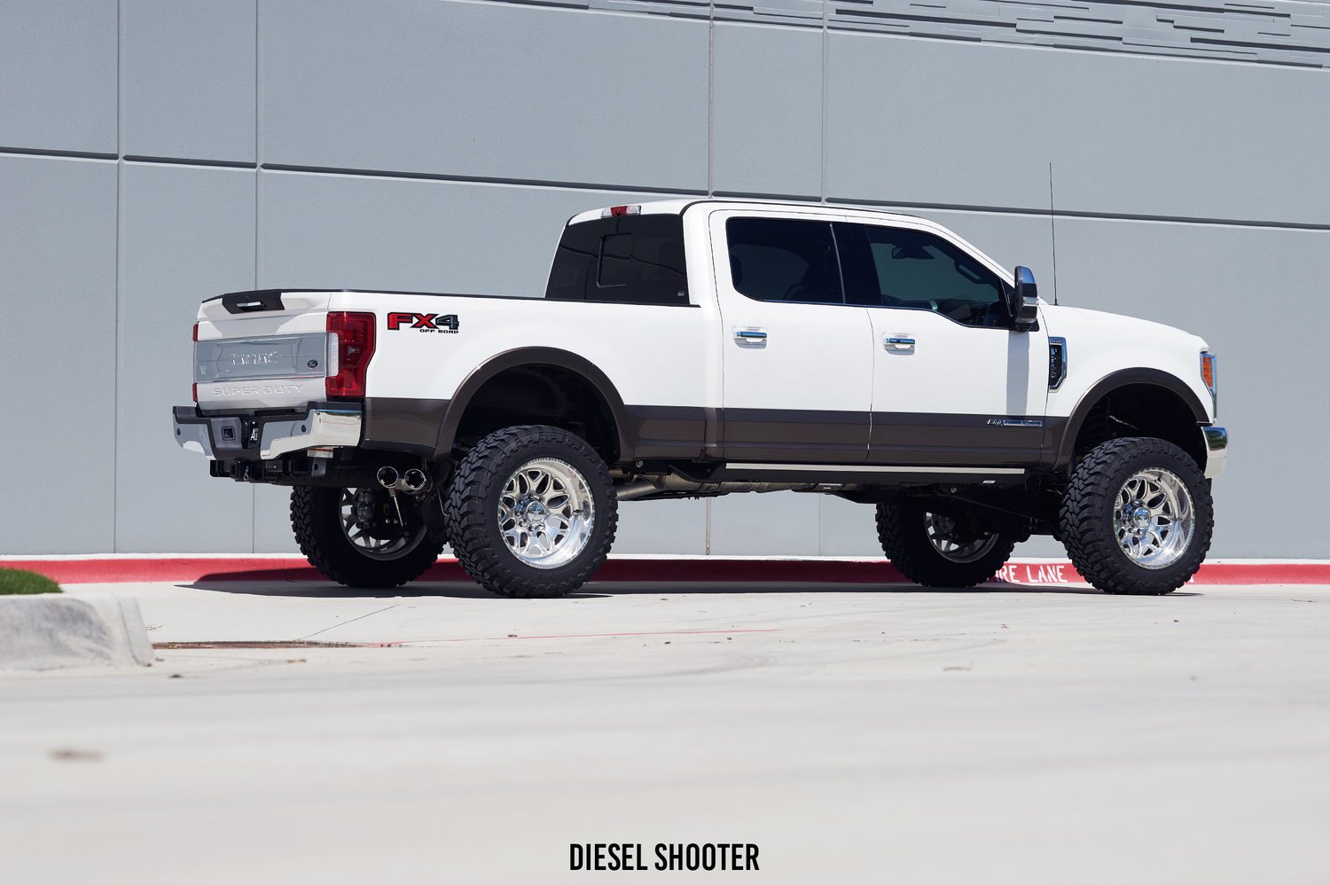 White Platinum Ford F-250 with Custom Suspension Lift Kit - Photo by Diesel Shooter