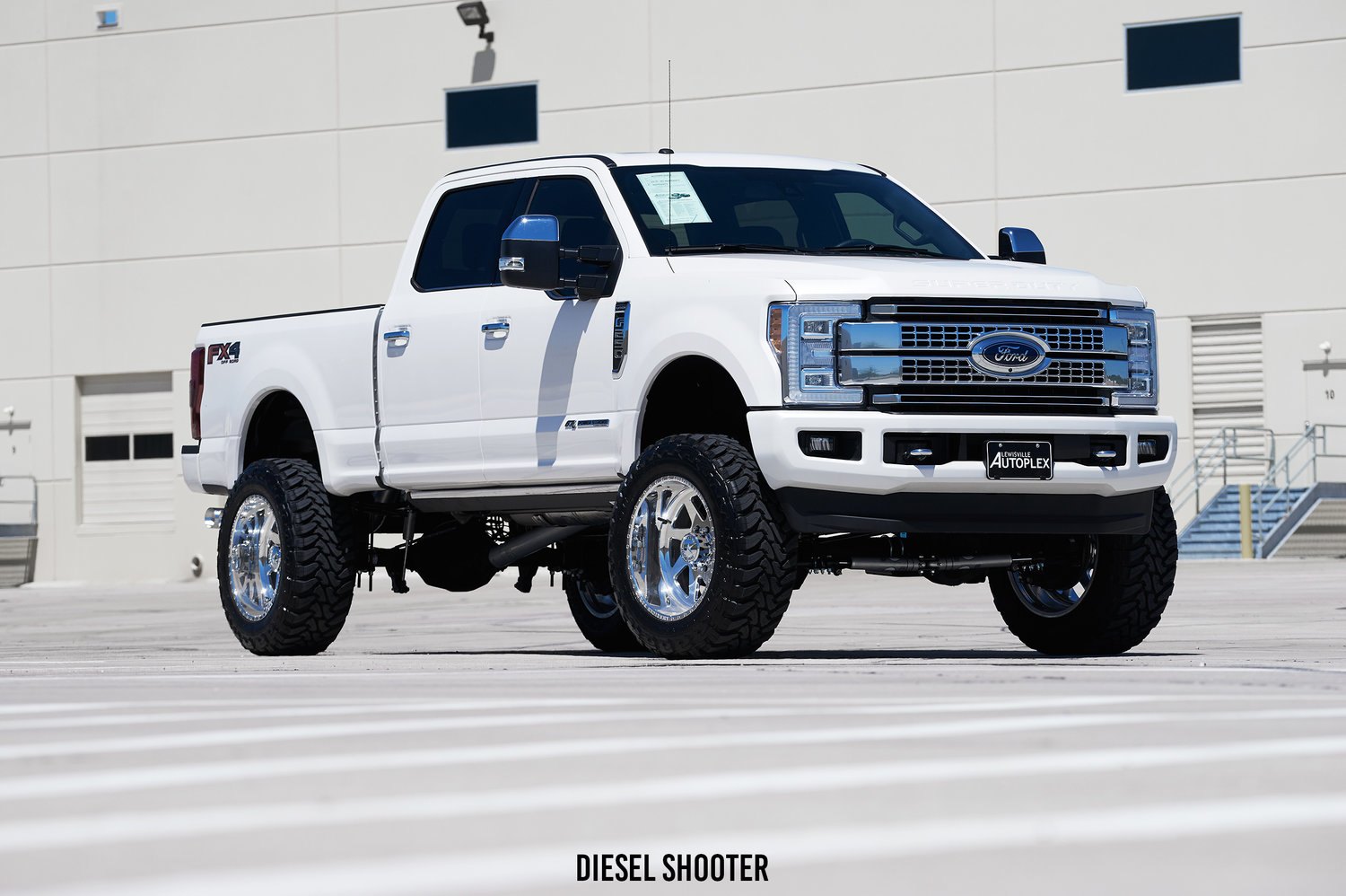 Chrome Front Bumper with Tow Hooks on Ford Super Duty - Photo by Diesel Shooter