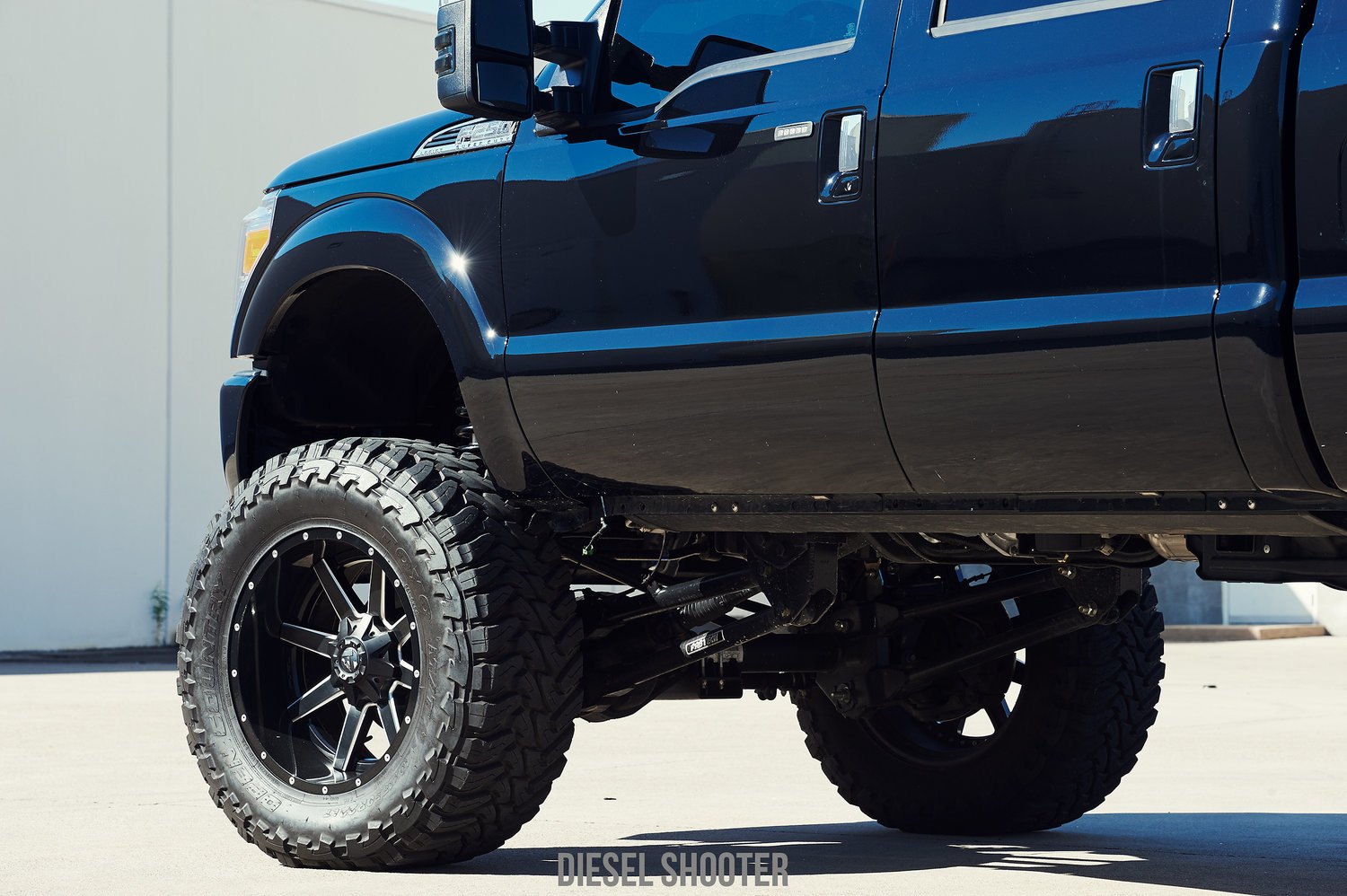 AMP Research PowerSteps on Lifted Ford F-250 - Photo by Diesel Shooter