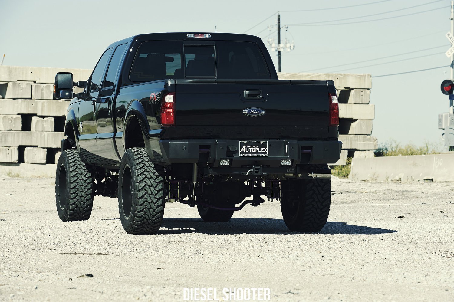 Custom Black Ford F-250 with Suspension Lift Kit - Photo by Diesel Shooter