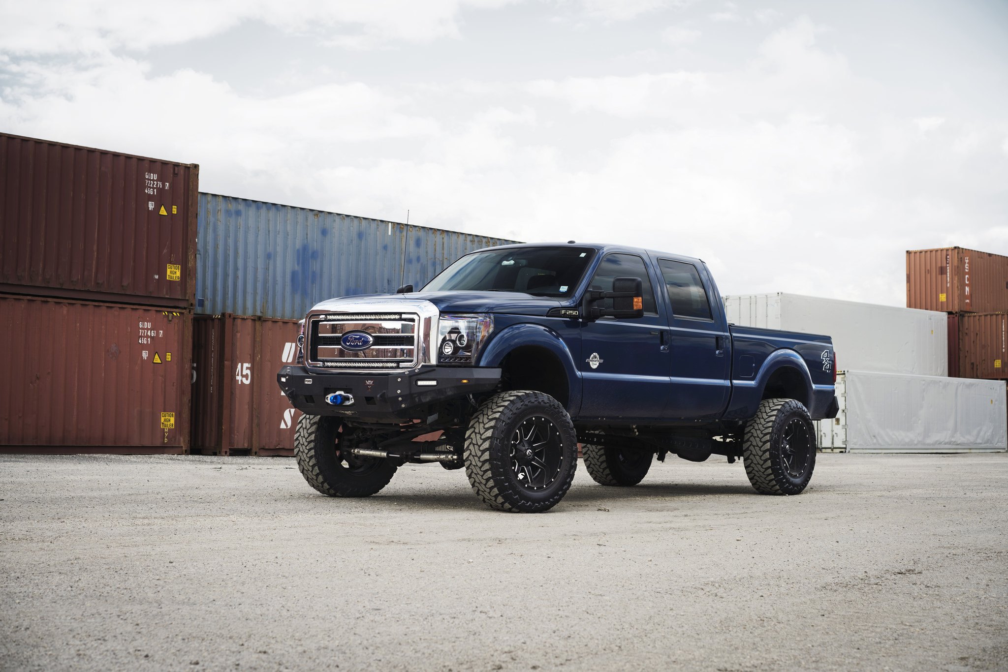 Blue Ford F-250 with 10 Inch Fox Suspension Kit - Photo by Fuel Offroad