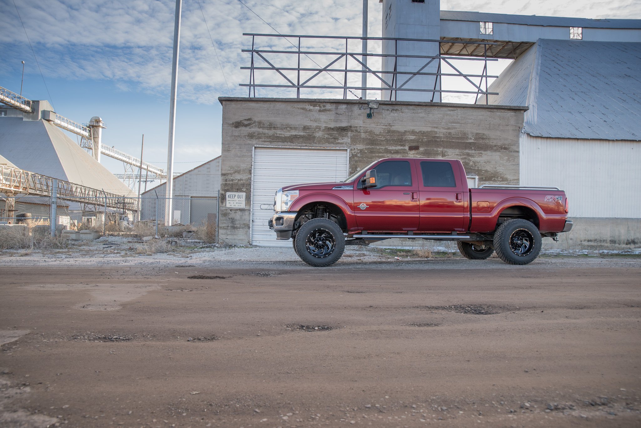 Aftermarket Side Steps on Red Ford F-250 - Photo by Fuel Offroad