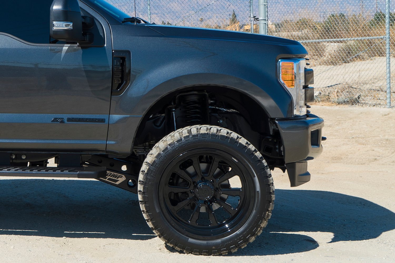 Black Ford F-250 with Pro Comp Lift Kit - Photo by Forgiato