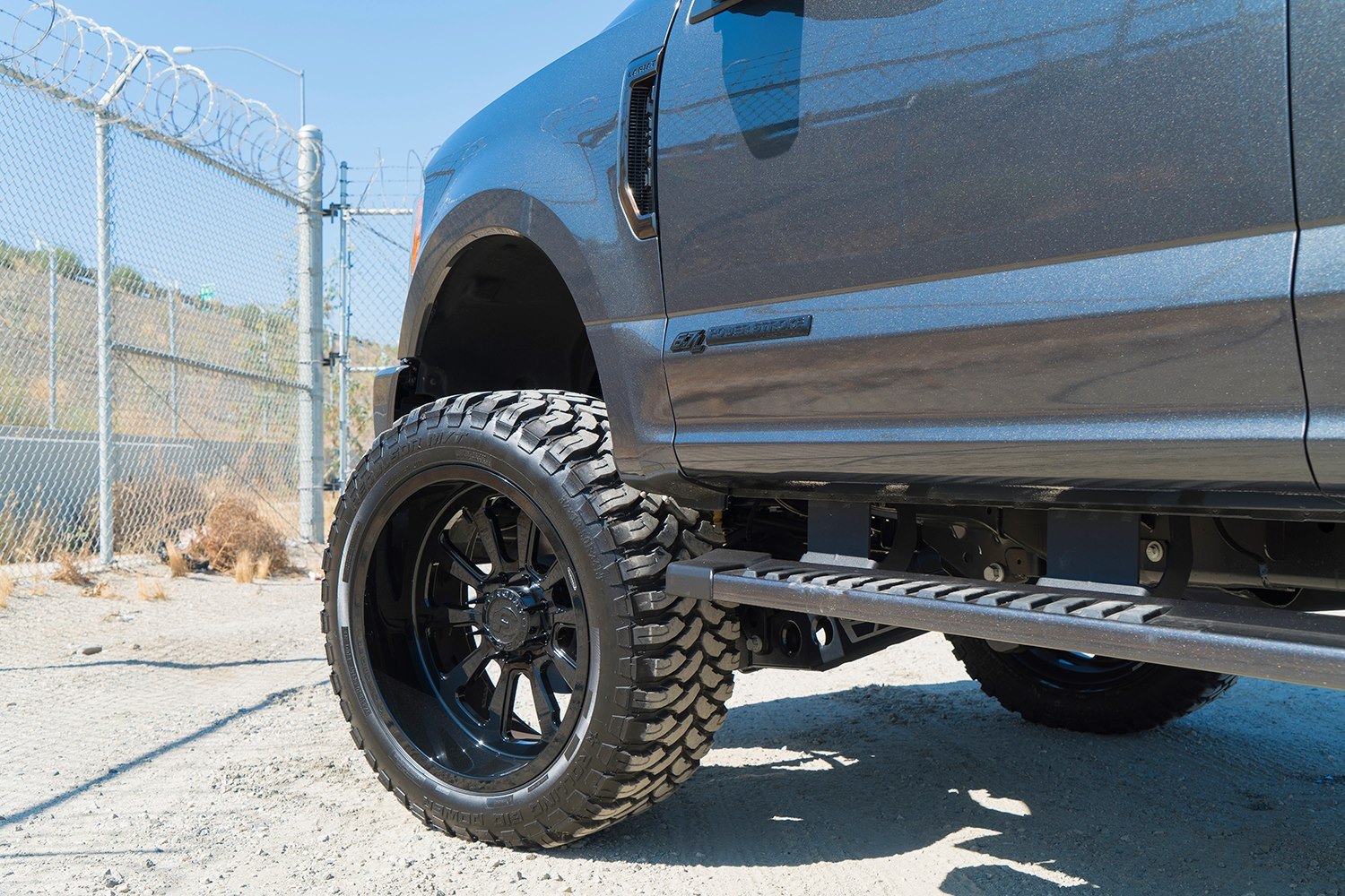 Custom Running Boards on Black Lifted Ford F-250 - Photo by Forgiato