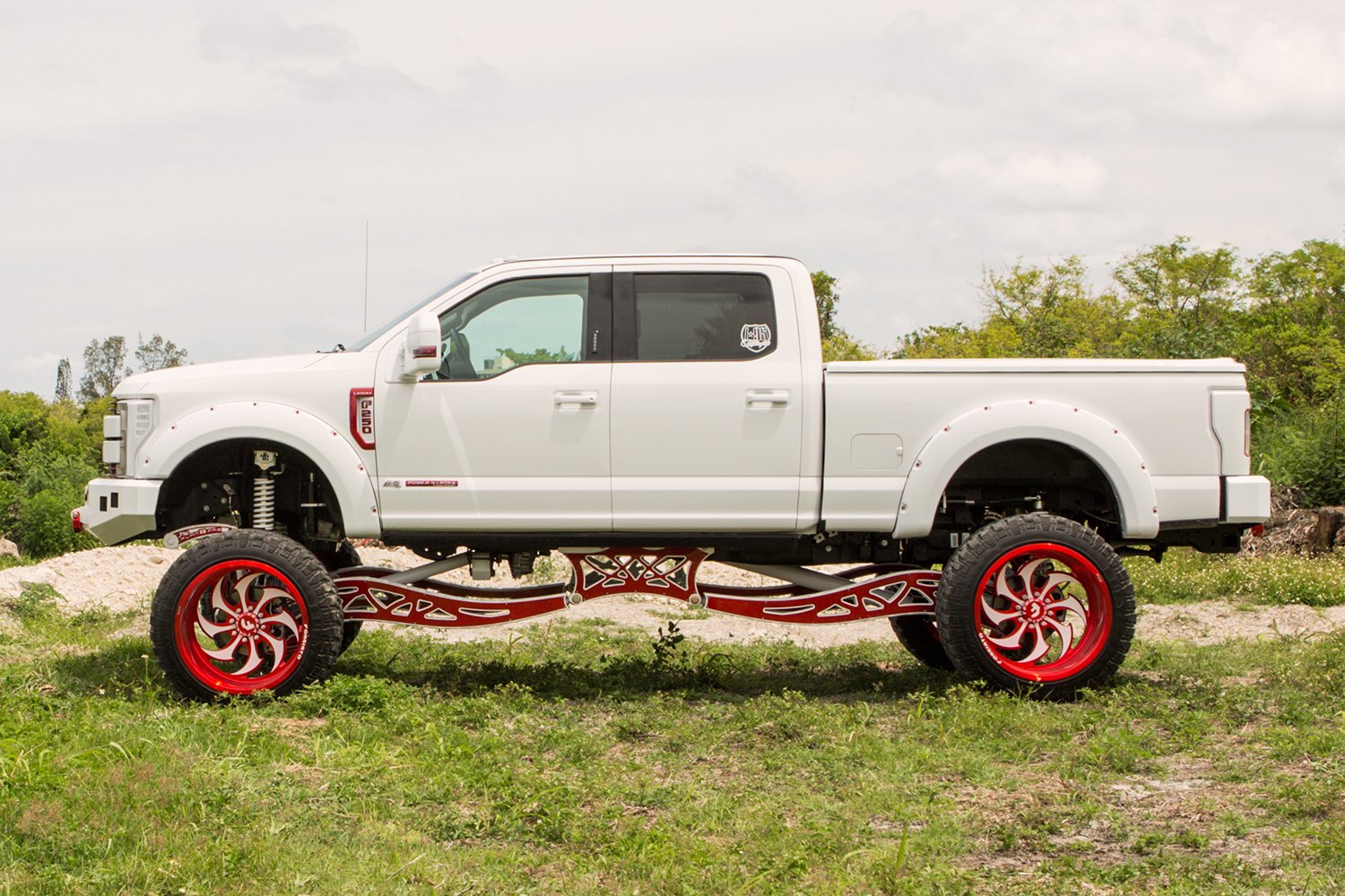 White Ford F-250 with Aftermarket Lift Kit - Photo by Forgiato