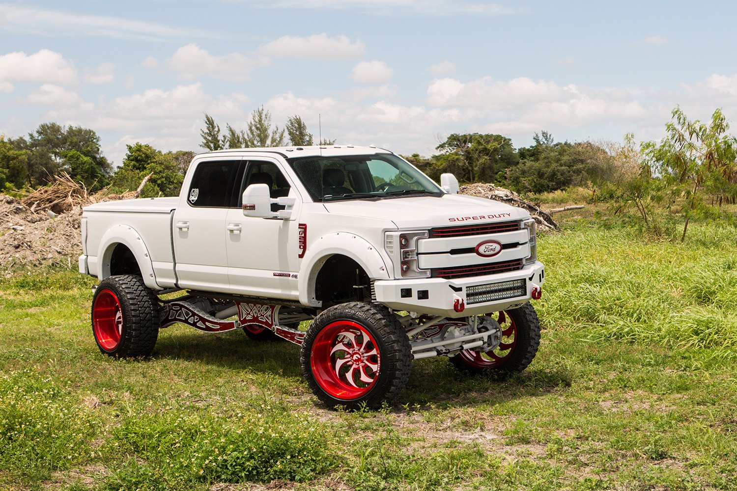 White Lifted Ford F-250 with Custom Headlights - Photo by Forgiato