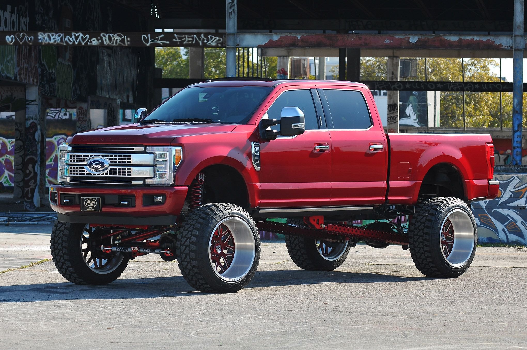 Red Lifted Ford F-250 with Chrome Mesh Grille - Photo by Phil Gordon