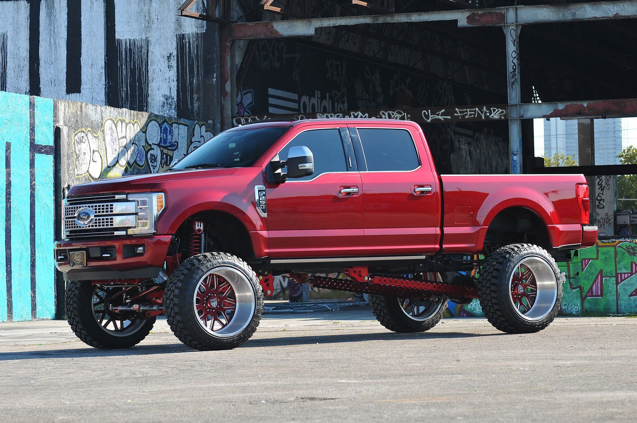 Red Lifted Ford F-250 with Custom Forged Wheels - Photo by Phil Gordon