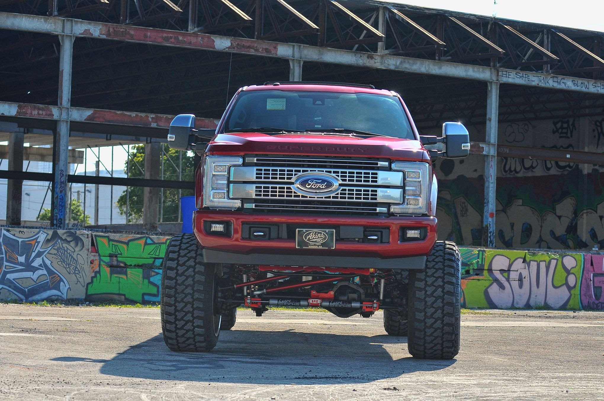 Custom Front Bumper on Red Lifted Ford F-250 - Photo by Phil Gordon