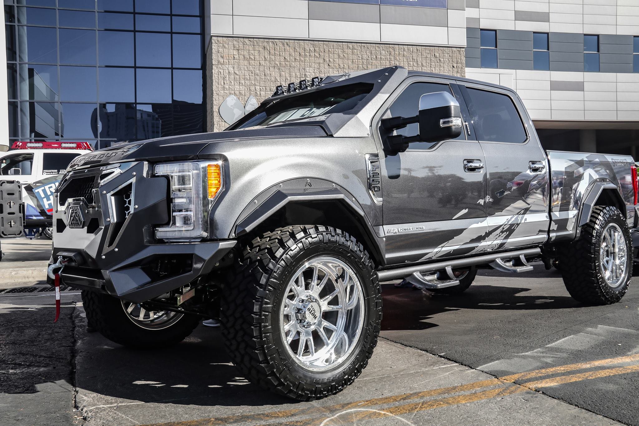 Gray Lifted Ford F-250 with Custom Headlights - Photo by Fab Fours