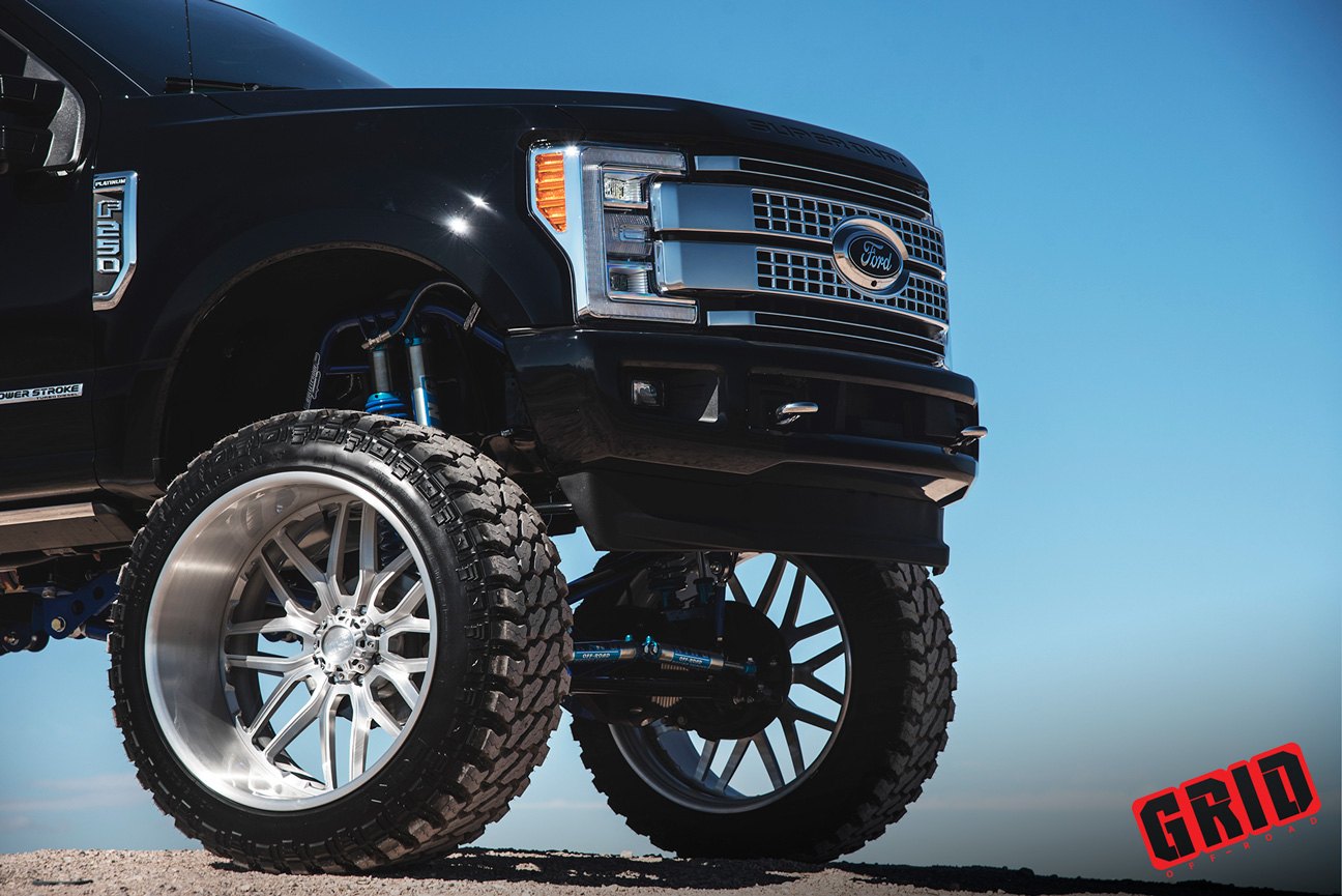 Black Lifted Ford F-250 with Chrome Grid Off-Road Wheels - Photo by Grid Off-Road