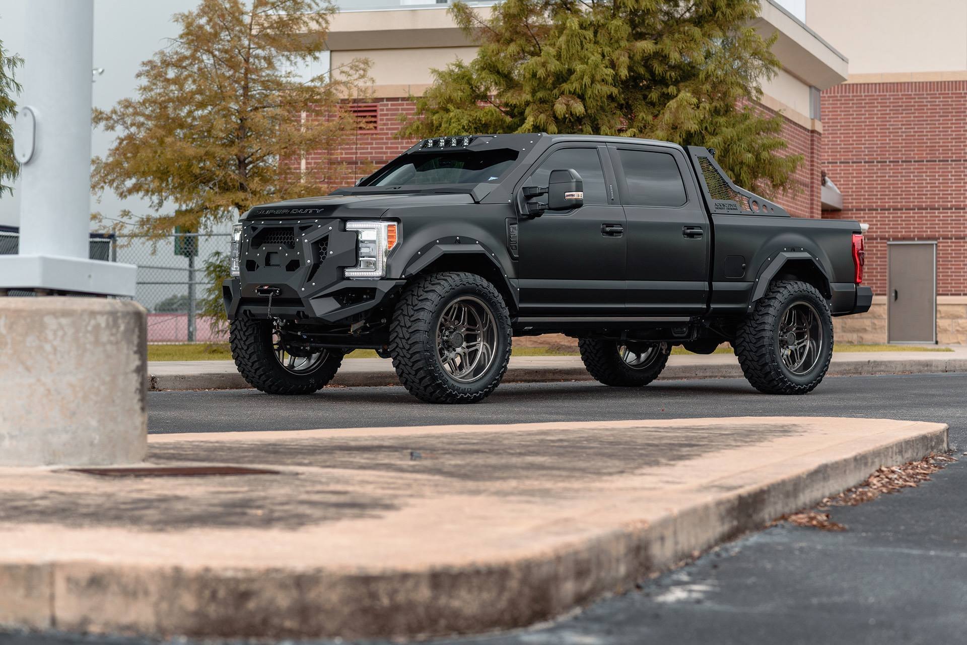 Custom Projector Headlights on Matte Black Ford F-250 - Photo by Forgiato