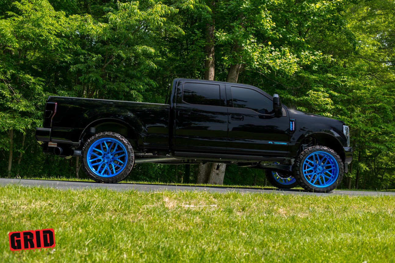 Custom Black Lifted Ford F-250 with Blue Accents - Photo by Grid Off-Road