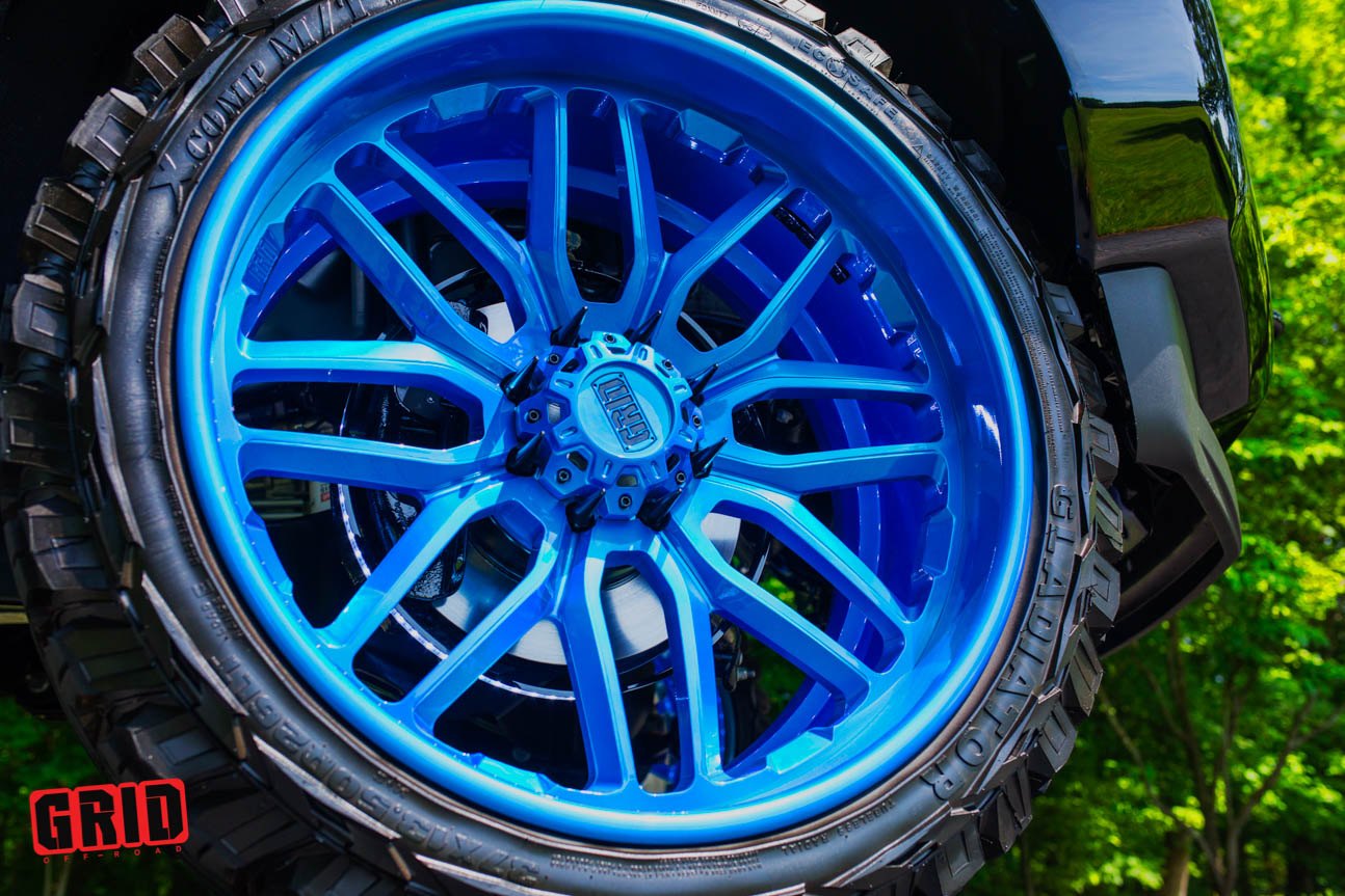 Blue Grid Off-road Wheels on Black Lifted Ford F-250 - Photo by Grid Off-Road