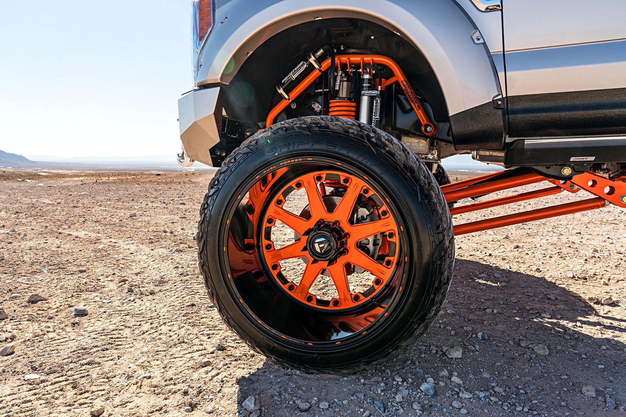 White Lifted Ford F-350 with Orange Fuel Wheels - Photo by Dale Martin