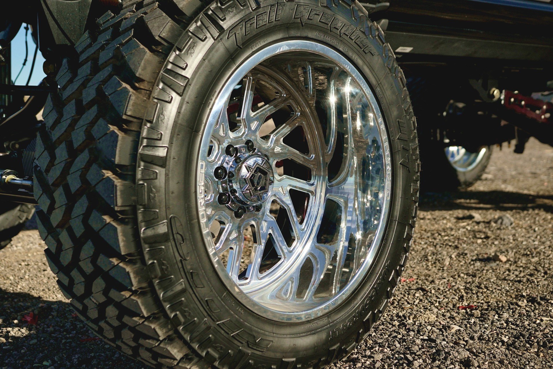 Chrome TIS Wheels on Black Lifted Ford F-350 - Photo by TIS Wheels
