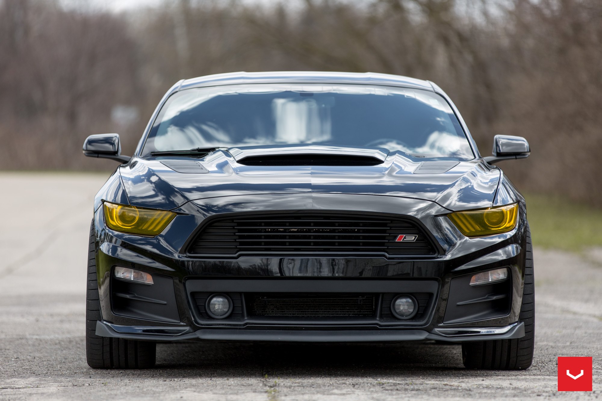 Black Ford Mustang with Aftermarket Yellow Headlights - Photo by Vossen
