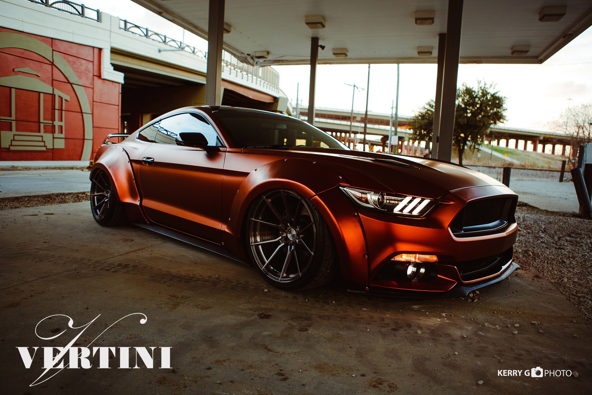 Aftermarket Projector Headlights on Orange Ford Mustang - Photo by Vertini Wheels