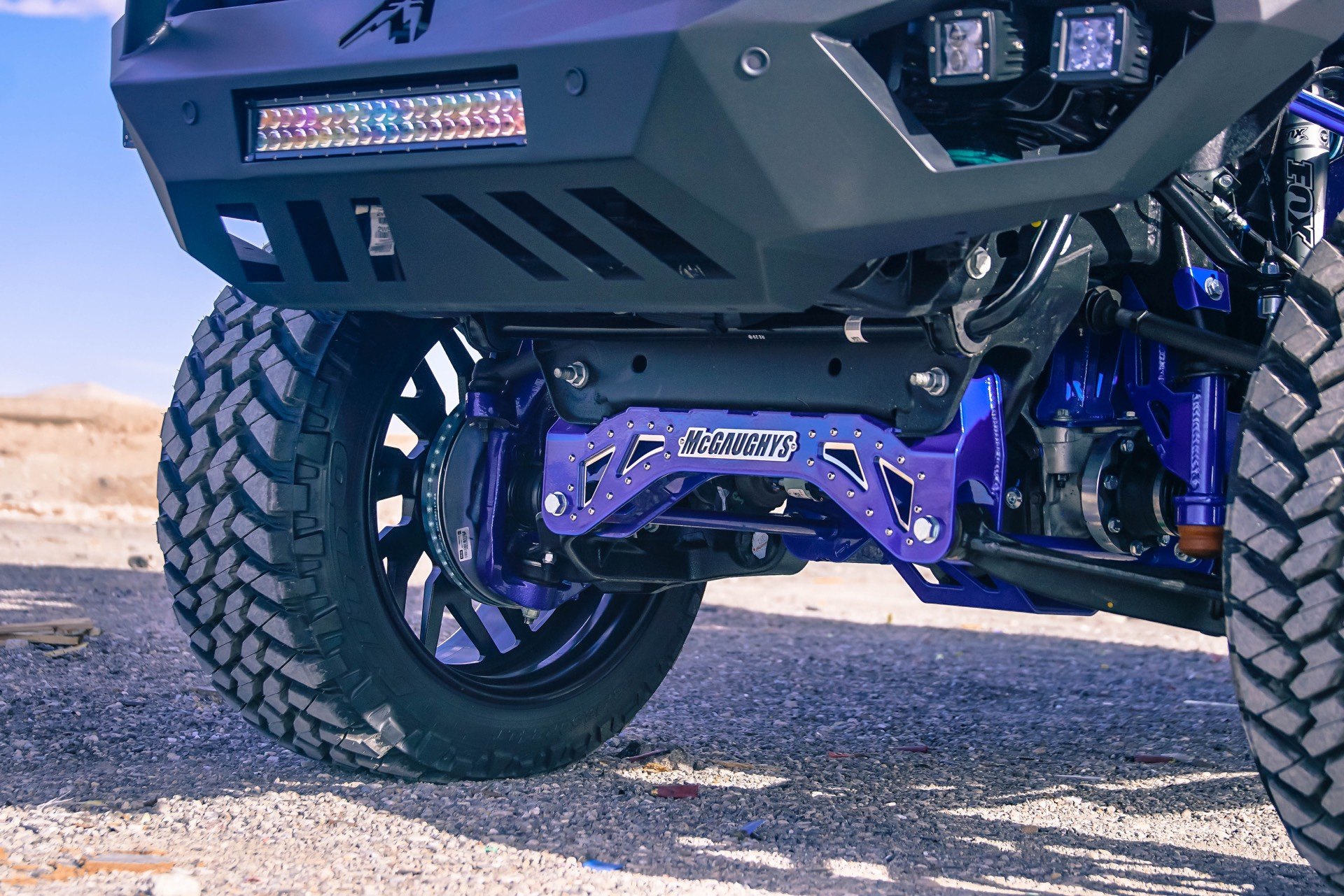 Custom Painted GMC Sierra with McGaughy's Suspension Kit - Photo by TIS Wheels