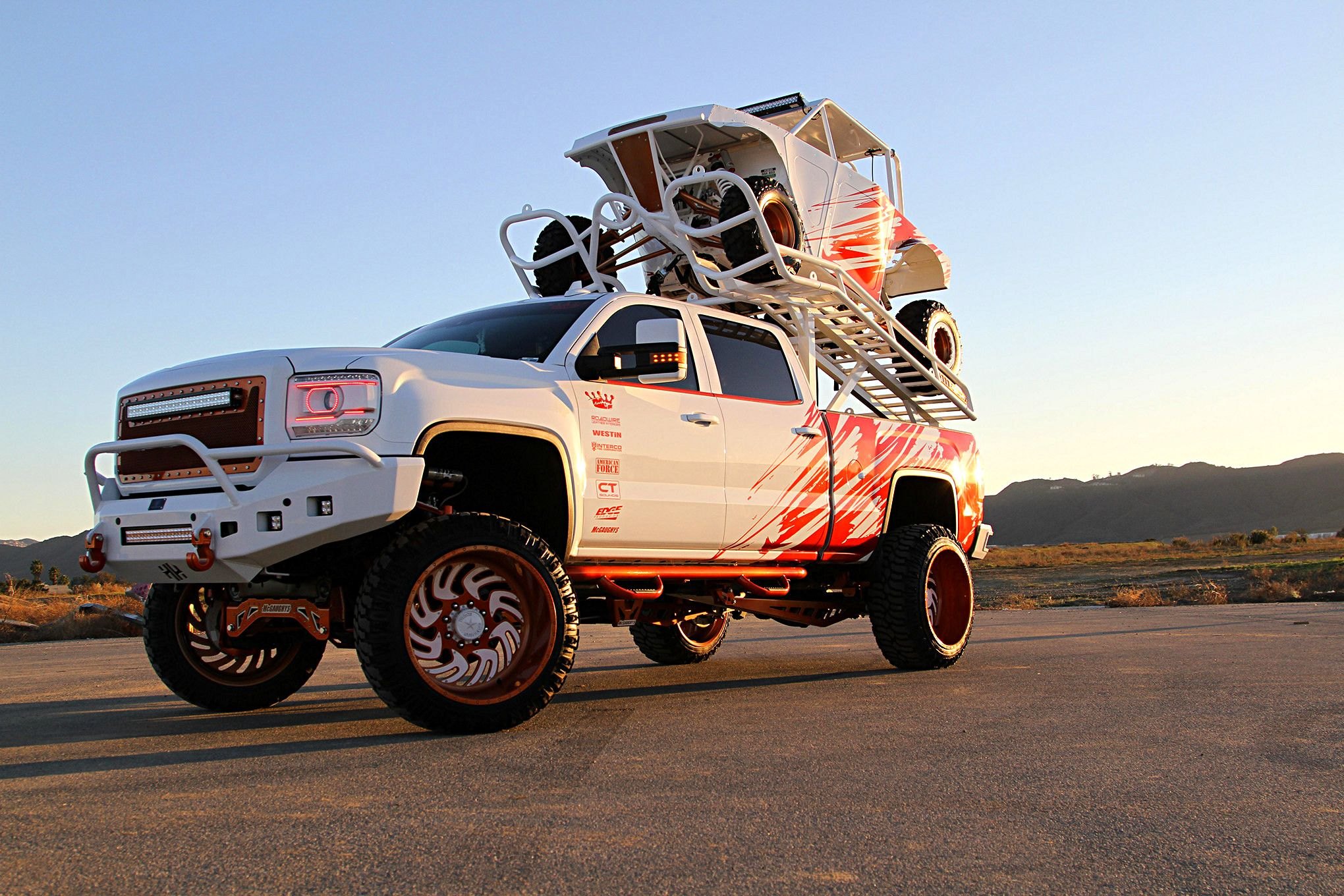 Winner combo - Lifted GMC Sierra + Colormatched UTV - Photo by Mike Alexander