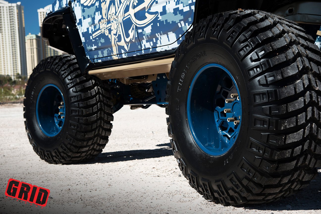 Lifted Camo Hummer H2 with Blue Grid Off-Road Wheels - Photo by Grid Off-Road