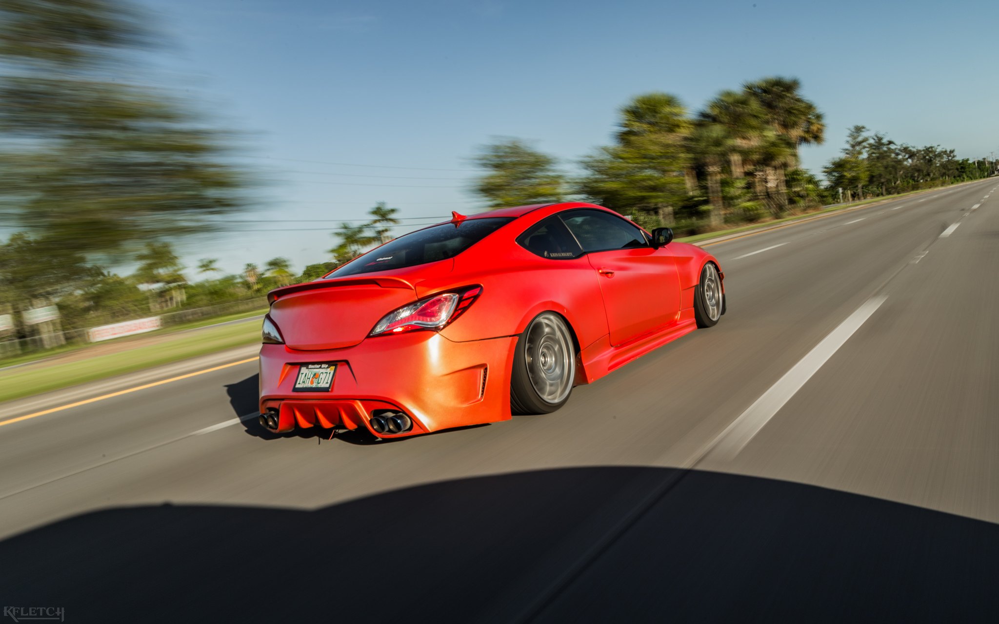 Aftermarket Exhaust System on Red Hyundai Genesis Coupe - Photo by kyle Fletcher