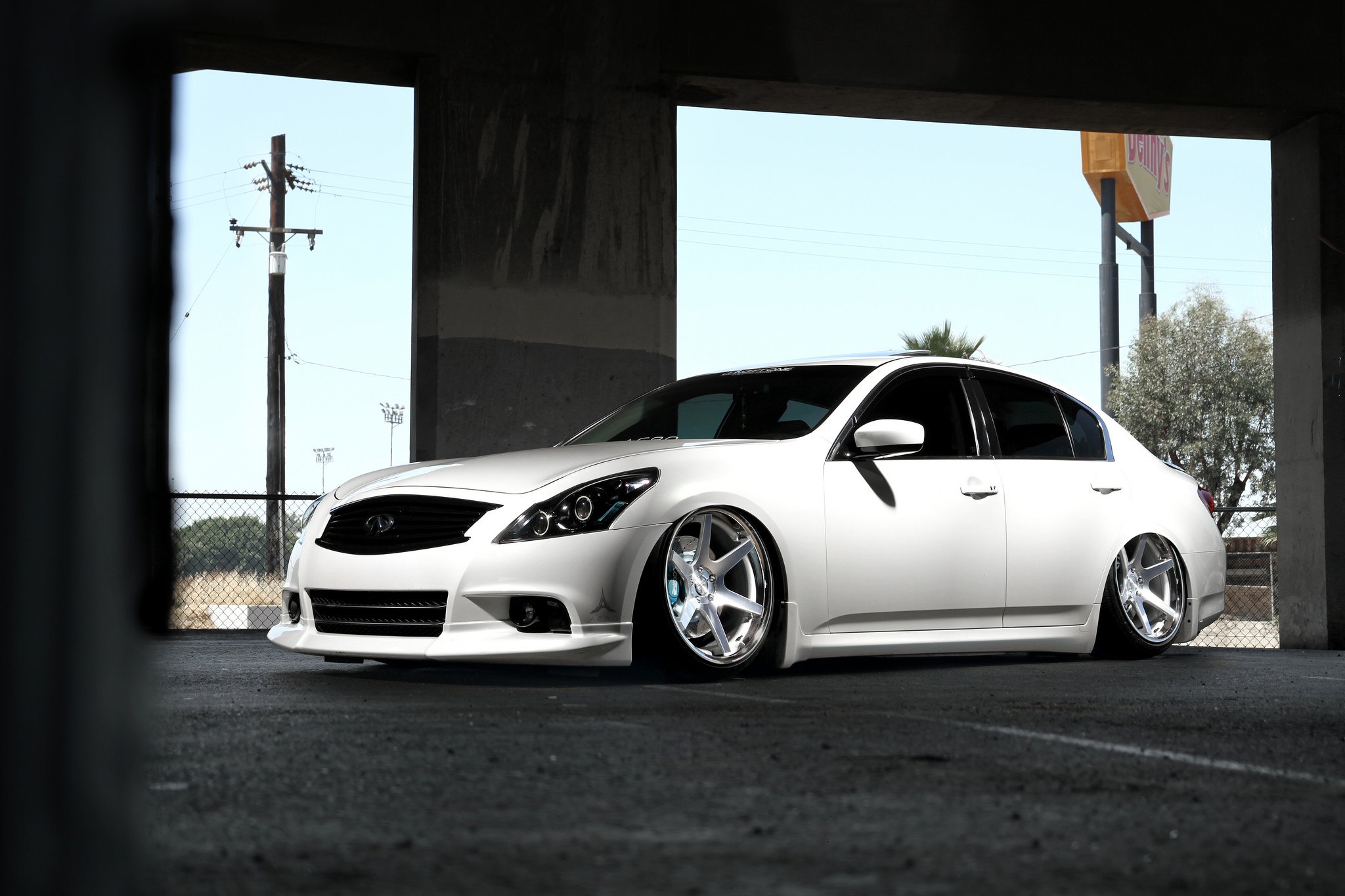 White Stanced Infiniti G37 with Aftermarket Headlights - Photo by Concept One