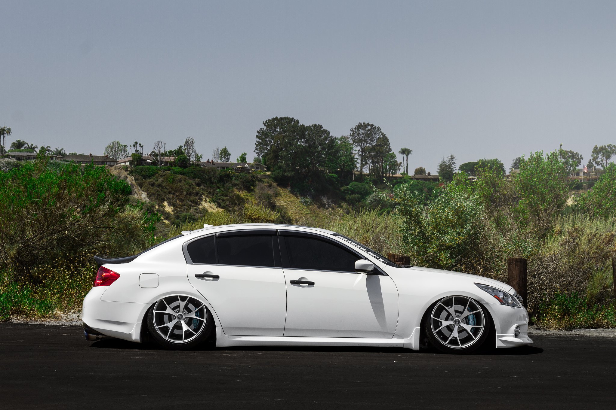 White Infiniti G37 with Chrome Concept One Wheels - Photo by Concept One