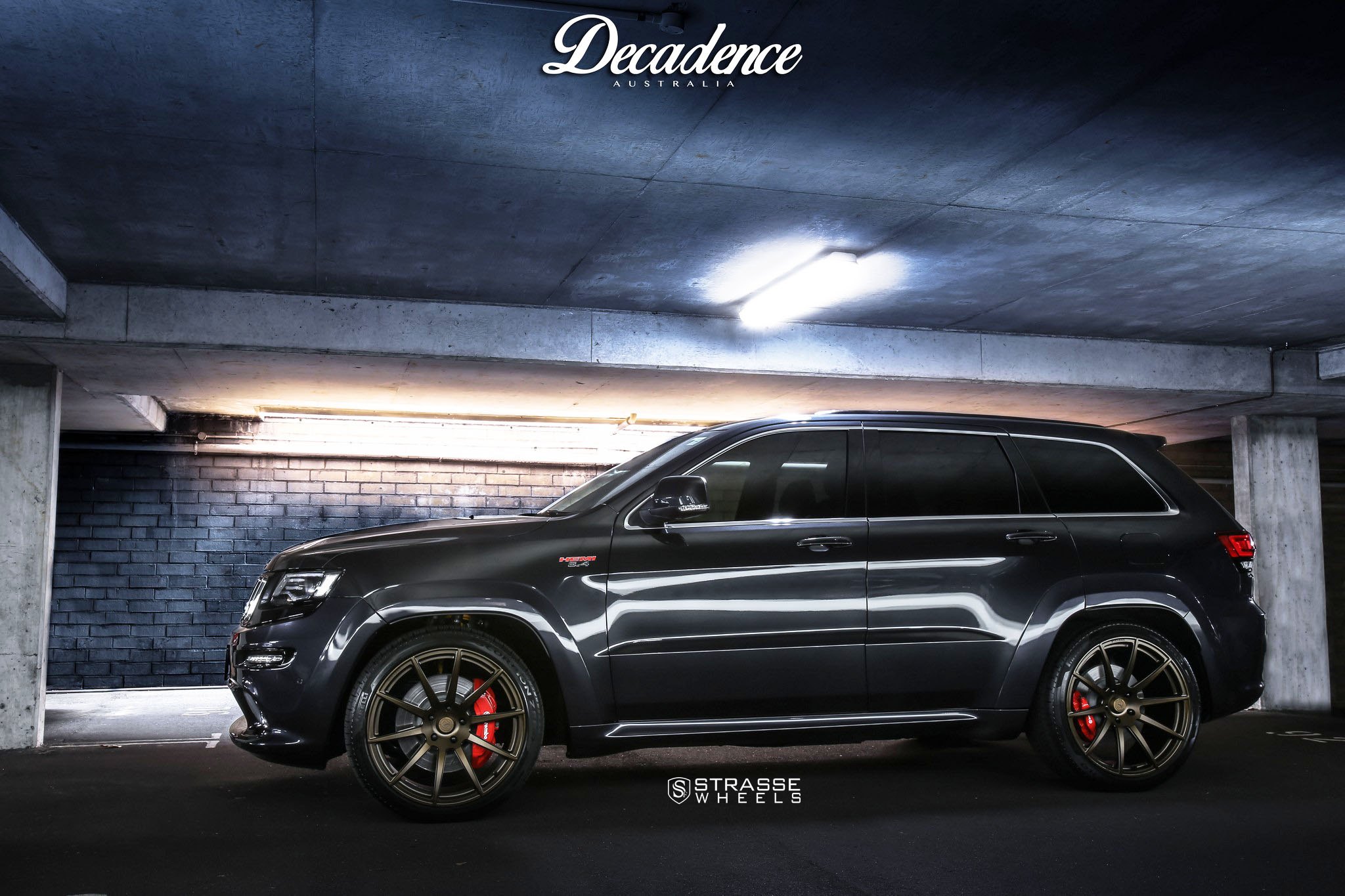 Black Jeep Grand Cherokee with Matte Bronze Strasse Rims - Photo by Strasse Forged