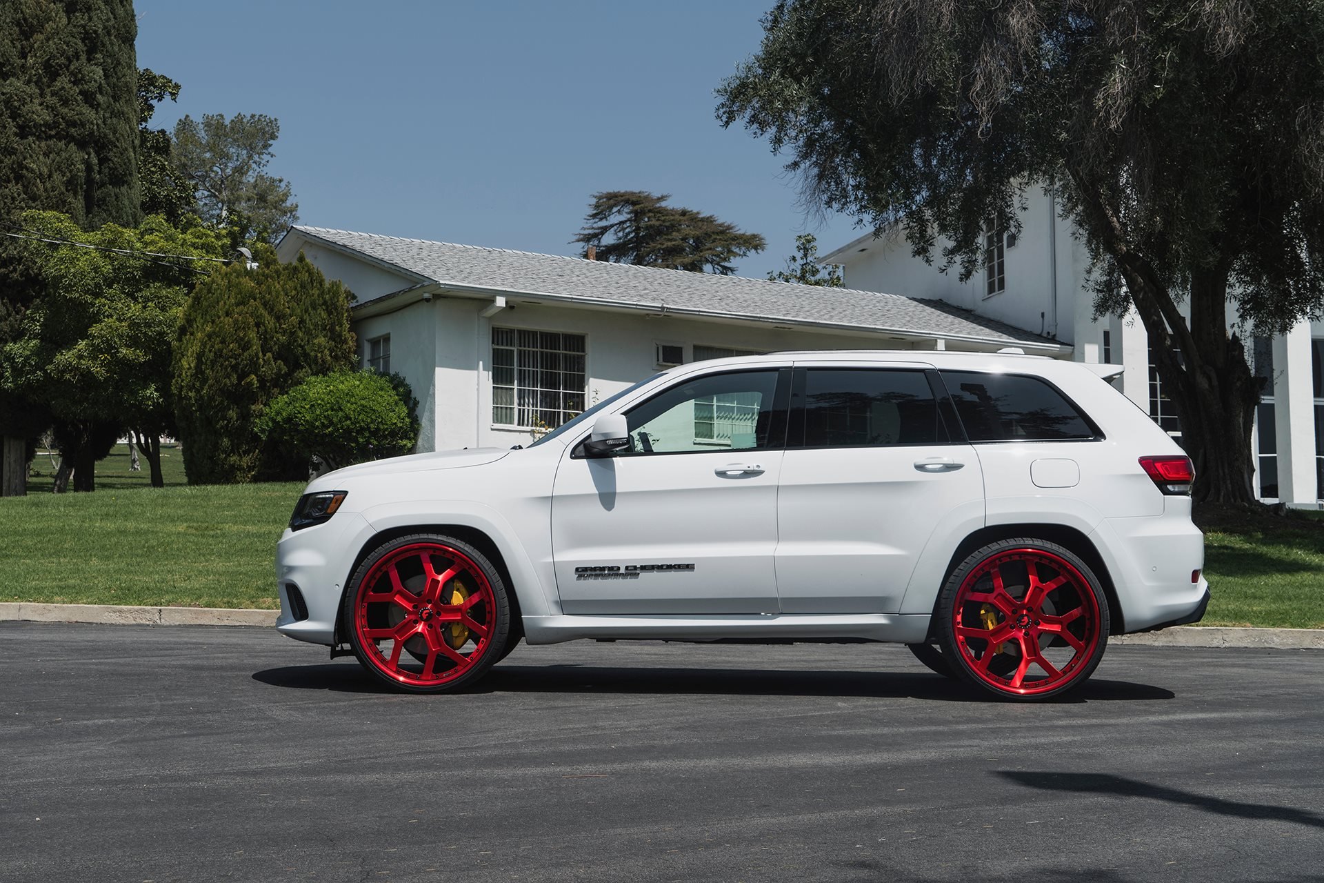 White Jeep Grand Cherokee with Custom Side Skirts - Photo by Forgiato